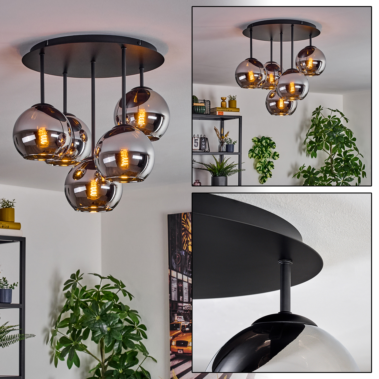 Eine moderne schwarze Pendelleuchte mit fünf kugelförmigen, rauchfarbenen Glasschirmen hängt von der Decke. Pflanzen und Dekoration im Hintergrund.