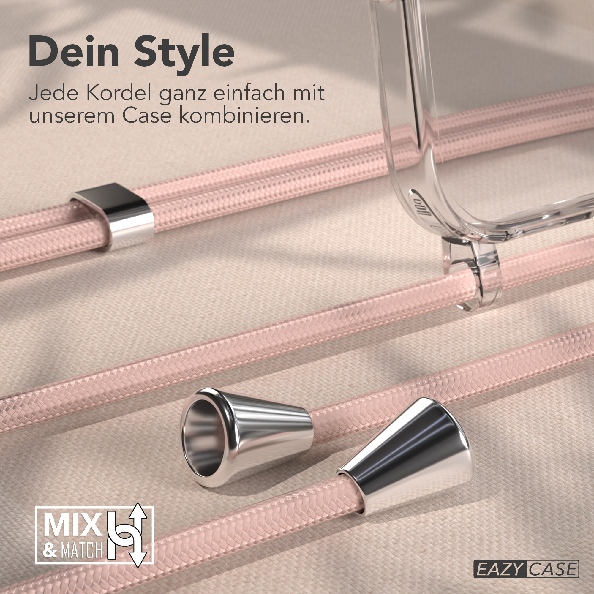 Das Bild zeigt rosa Kordeln mit silbernen Akzenten, eine transparente Handyhülle und Text. Der Hintergrund ist eine strukturierte beige Oberfläche.