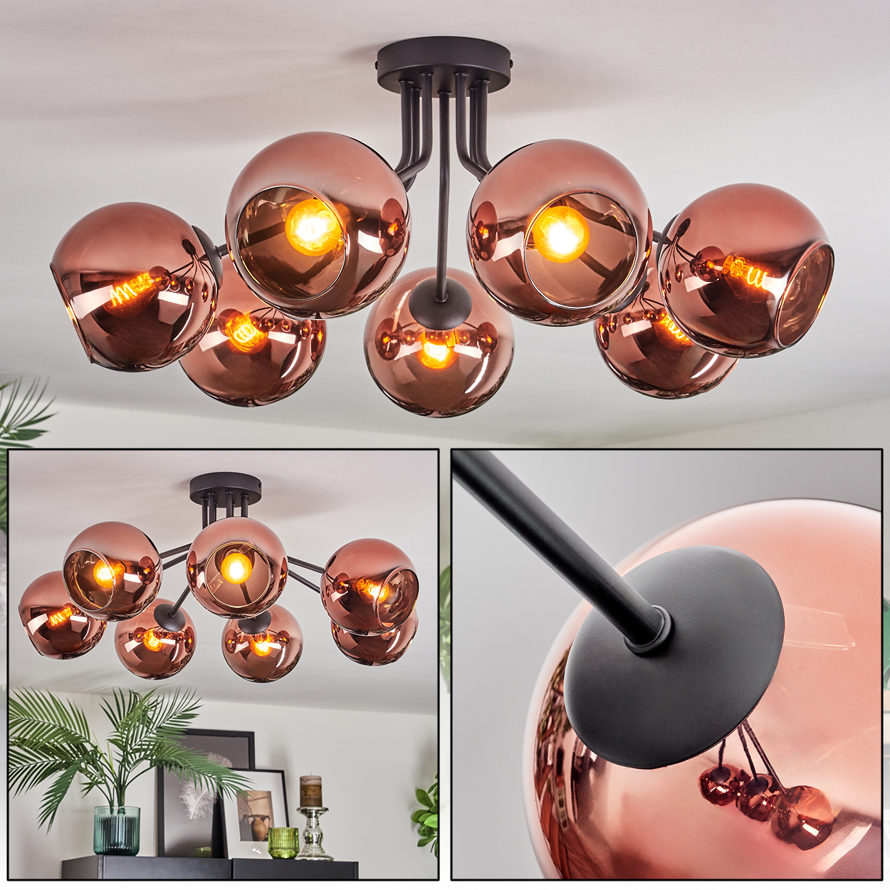 Eine moderne Deckenlampe mit kupferfarbenen Kugelschirmen und schwarzen Armen. Die Lichter sind an und reflektieren das Licht. Der Hintergrund ist weiß.