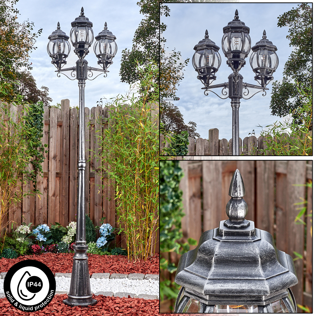 Eine dekorative Außenlaterne mit drei Lampen. Sie steht in einem Garten mit Bambus, einem Holzzaun und Blumen.