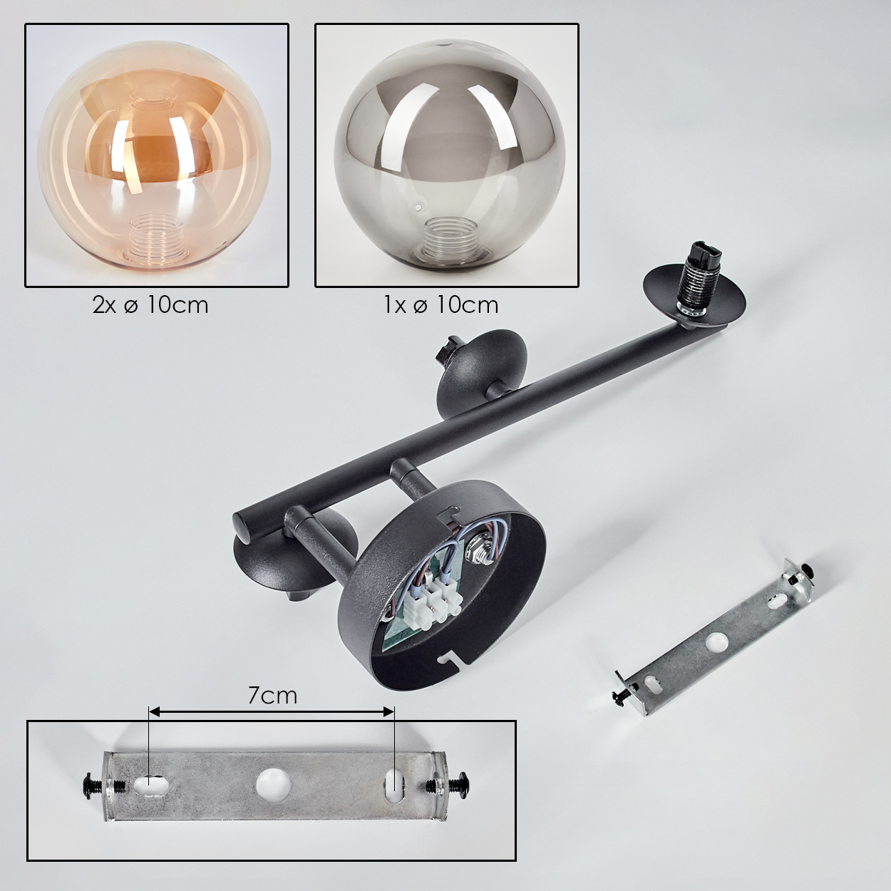 Zerlegte schwarze Lampe mit drei Glaskugeln, Befestigungsteilen und einer 7 cm Halterung. Zwei orangefarbene und eine graue Kugel.