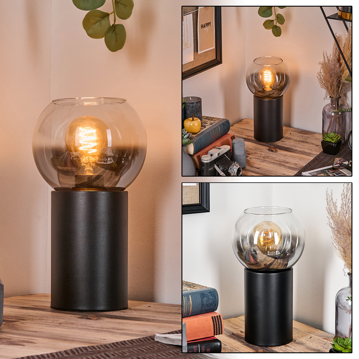 Eine dekorative Lampe mit Glaskugel und schwarzem Sockel auf einem Holztisch. Bücher, eine Kamera und ein gerahmtes Bild im Hintergrund.