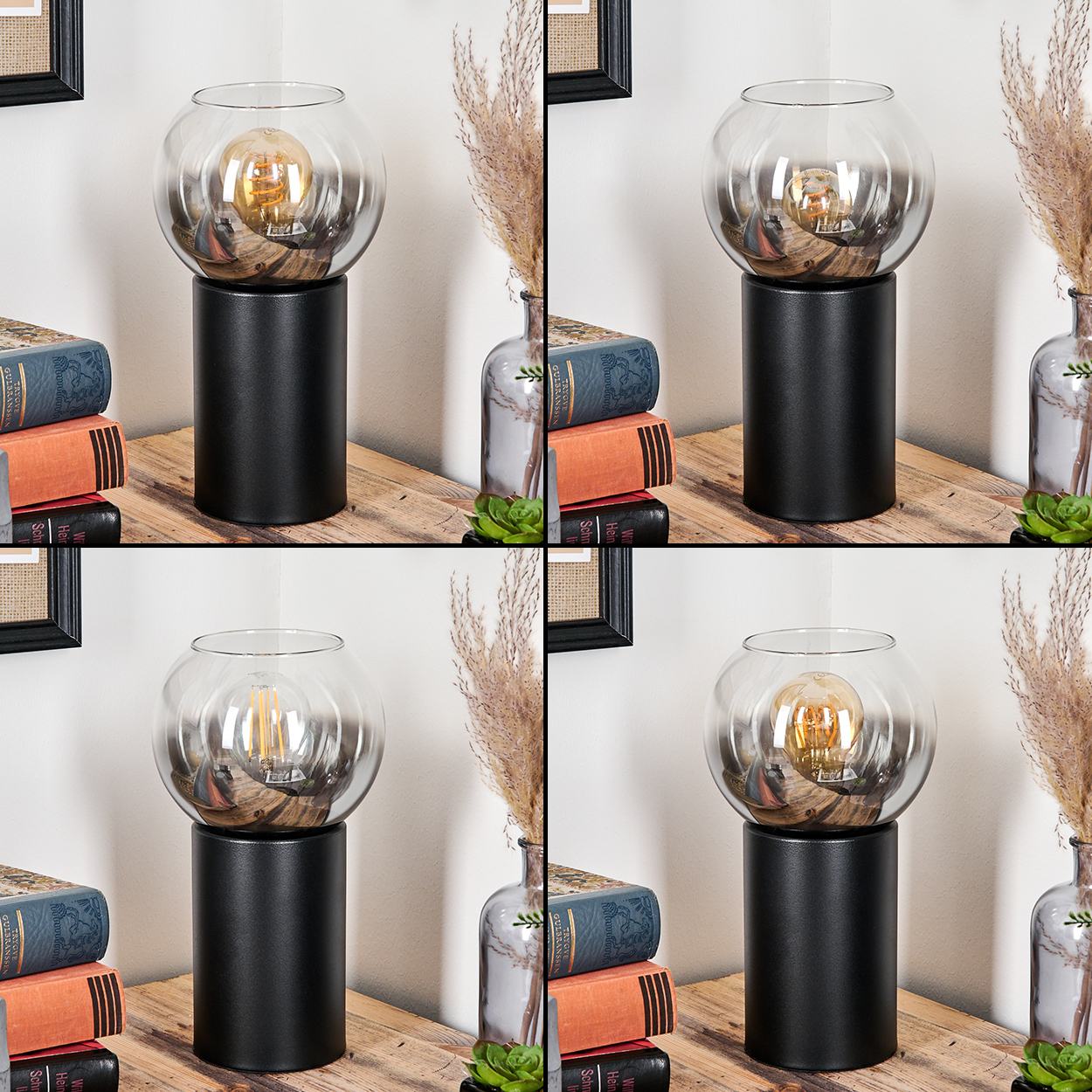 Eine moderne Lampe mit Glaskugel und schwarzem Fuß steht auf einer Holzoberfläche. Bücher, eine Vase mit Pflanzen und Wandkunst ergänzen die Szene.