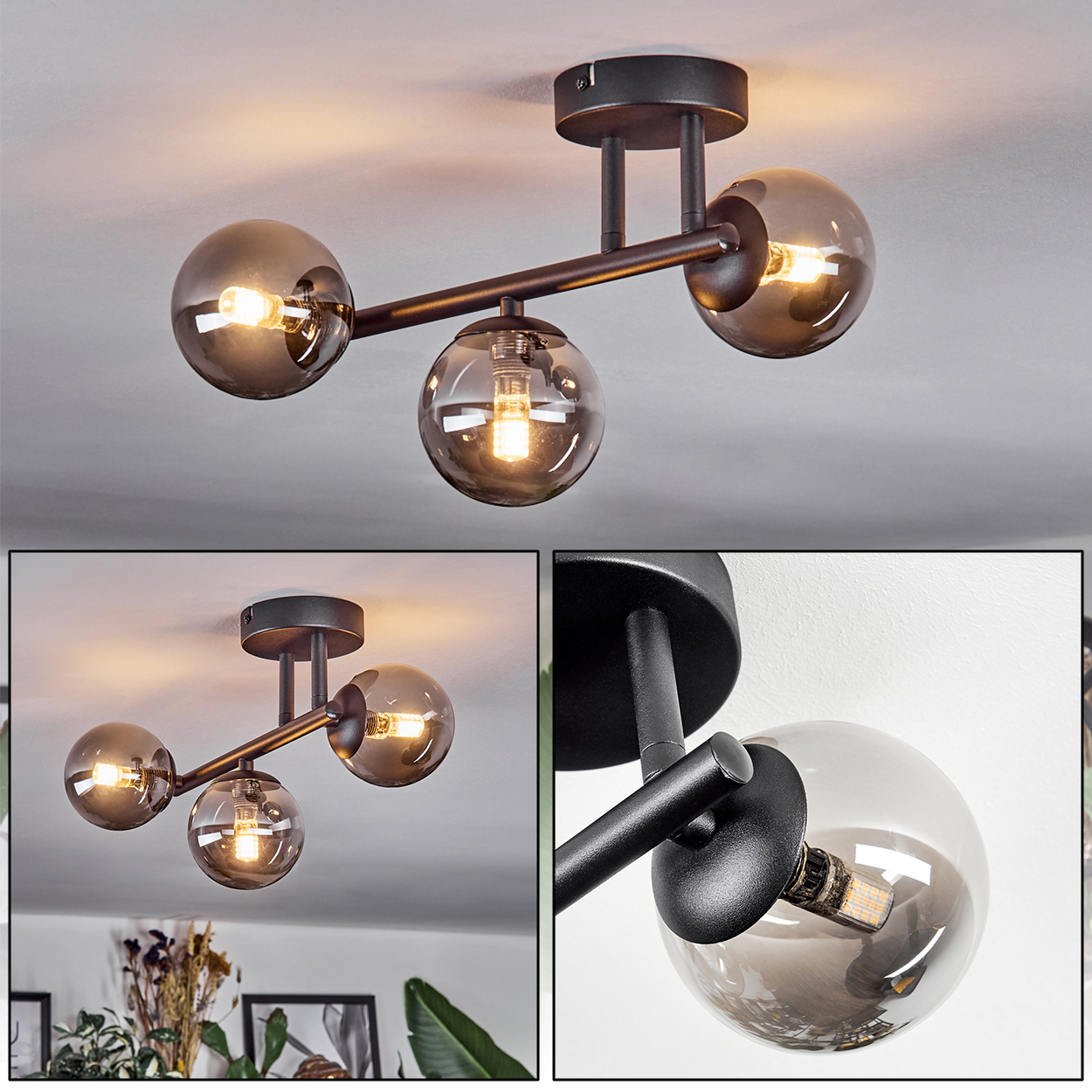 Eine moderne Deckenleuchte mit drei kugelförmigen Glasschirmen, schwarzen Metallarmen und warmen Glühbirnen.