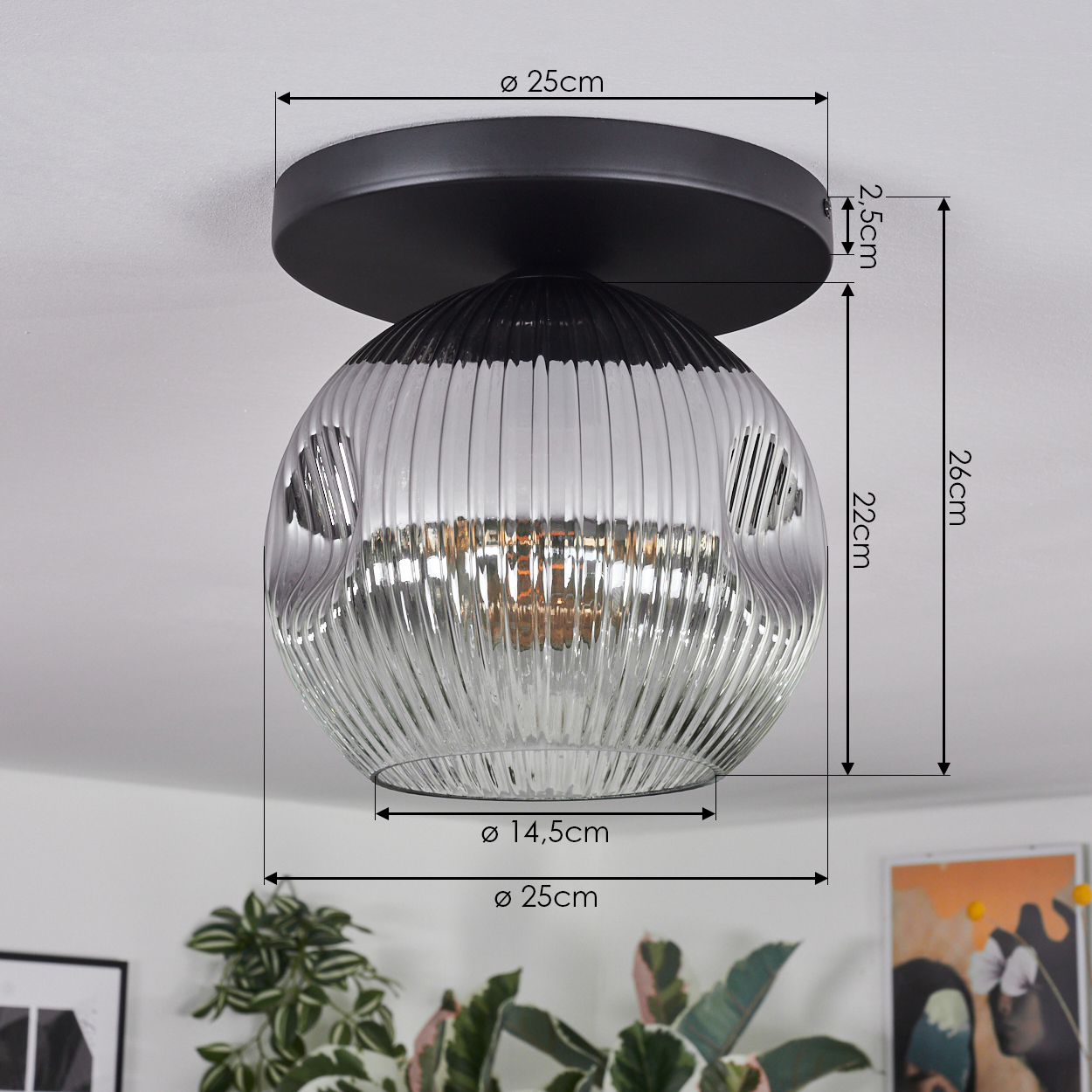 Eine moderne Deckenlampe mit schwarzem Sockel und geriffeltem Glasschirm. Abmessungen sind mit Pfeilen und Zahlen angegeben.