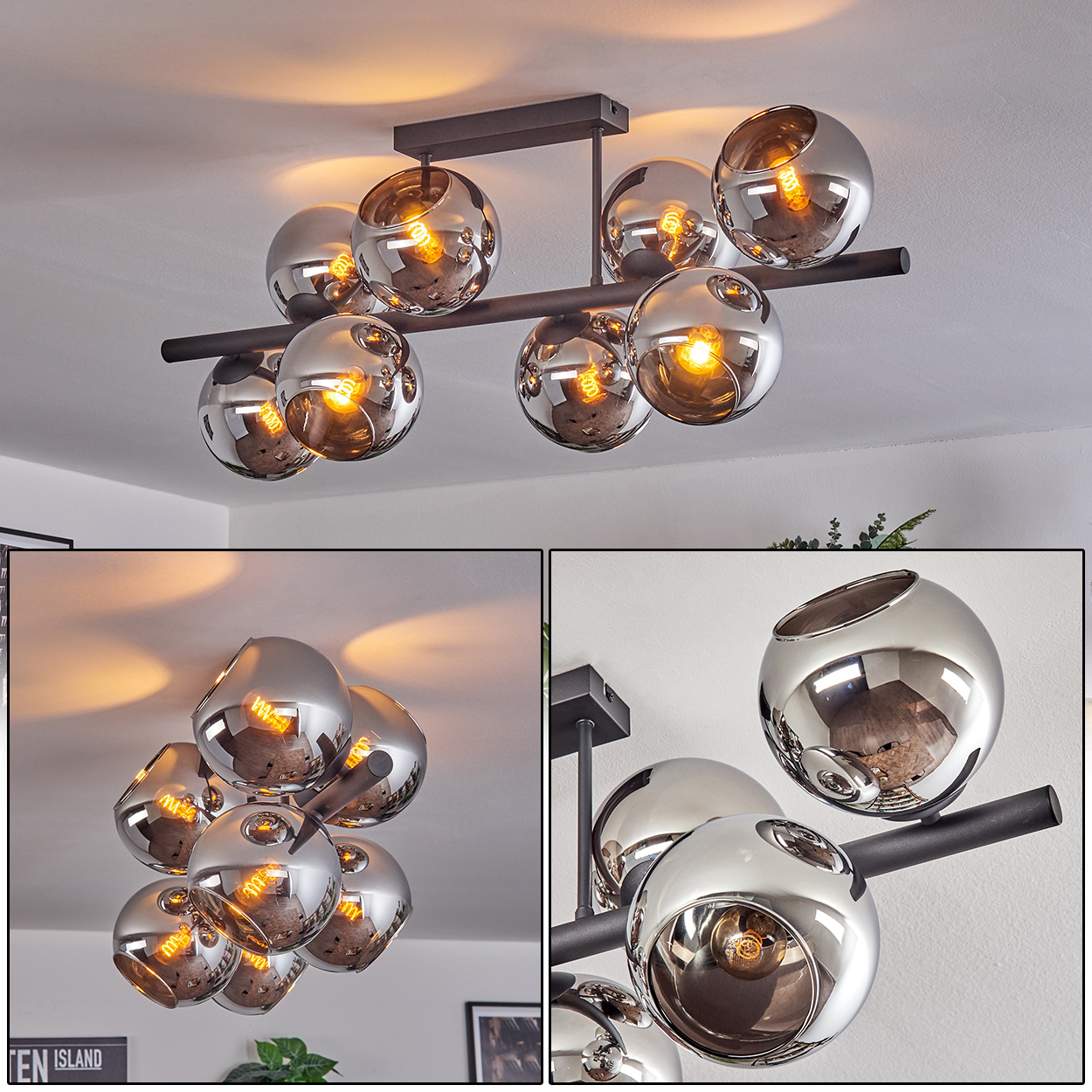 Eine moderne Deckenlampe mit silbernen kugelförmigen Schirmen und warmen Glühbirnen, montiert auf einem schwarzen Rahmen. Der Hintergrund ist eine weiße Decke.