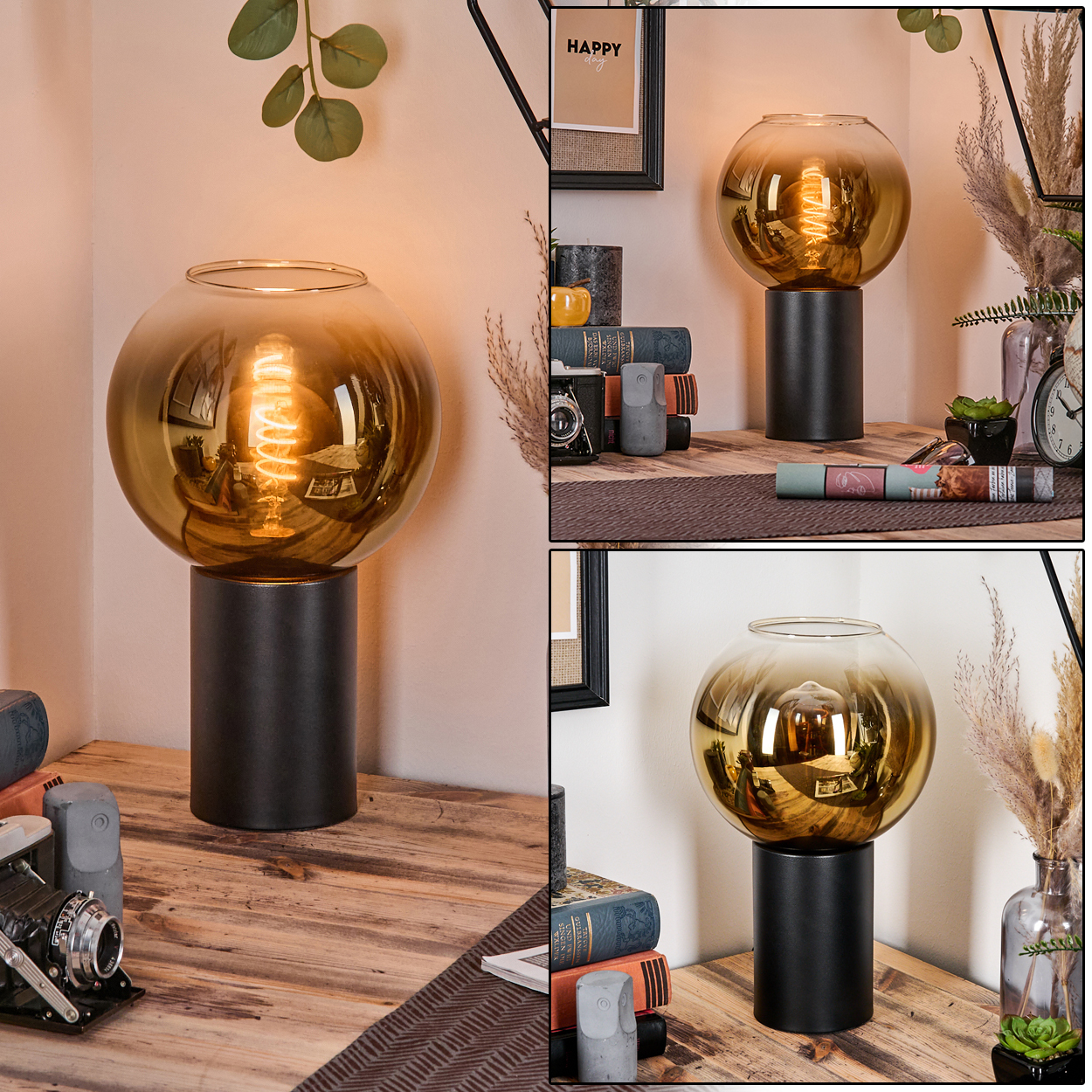 Eine dekorative Lampe mit goldener Glaskugel steht auf einem schwarzen Sockel. Sie steht auf einem Holztisch mit Büchern, einer Kamera und Dekoration.