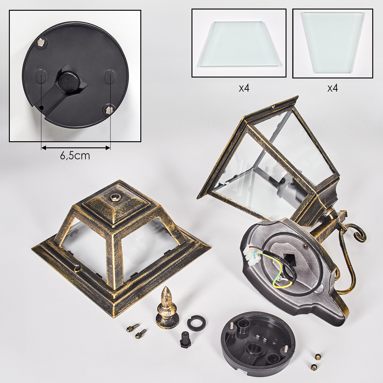 Zerlegte Teile einer Außenlampe. Enthält Basis, Oberteil, Glasscheiben, Schrauben und eine dekorative Spitze, alles vor weißem Hintergrund.