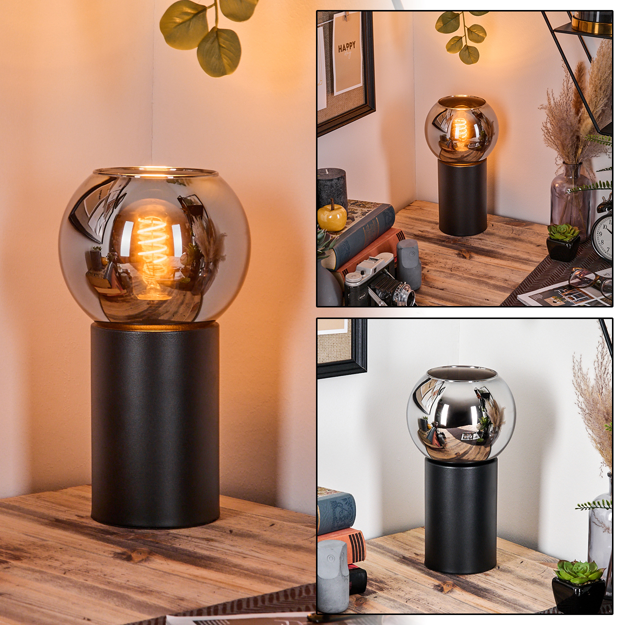 Eine moderne Lampe mit kugelförmigem Glasschirm auf schwarzem, zylindrischen Sockel. Sie steht auf einem Holztisch, mit Deko im Hintergrund.