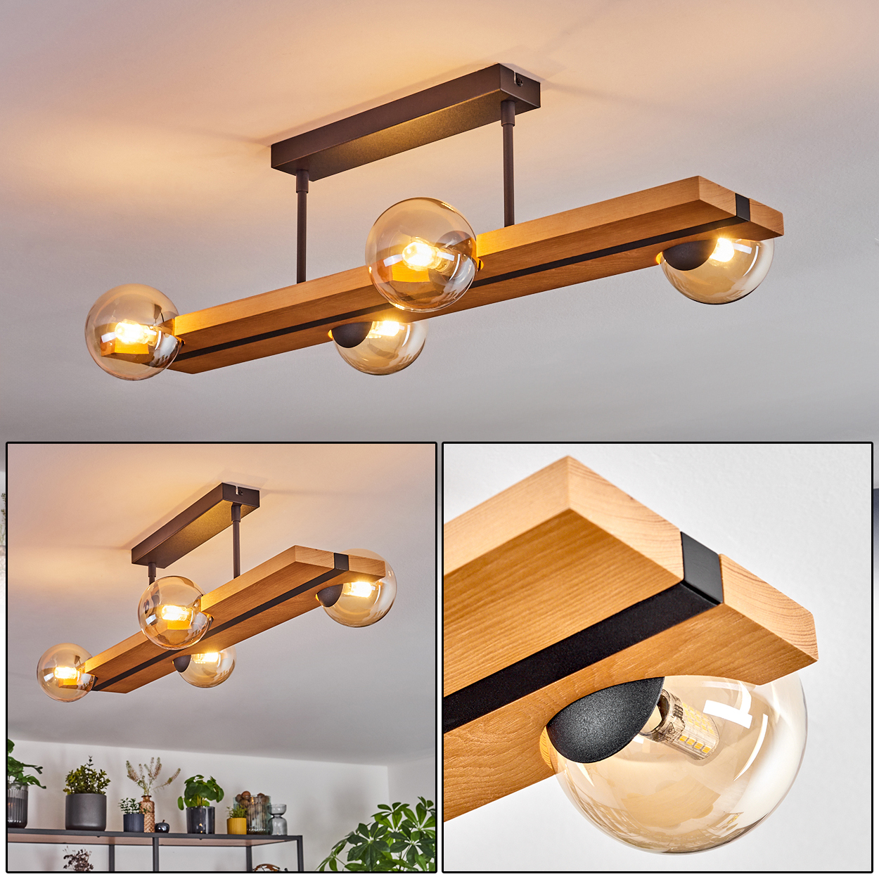 Eine moderne Deckenleuchte mit Holzbalken, schwarzen Metallakzenten und vier Glaskugelschirmen, jede mit warmem Licht.