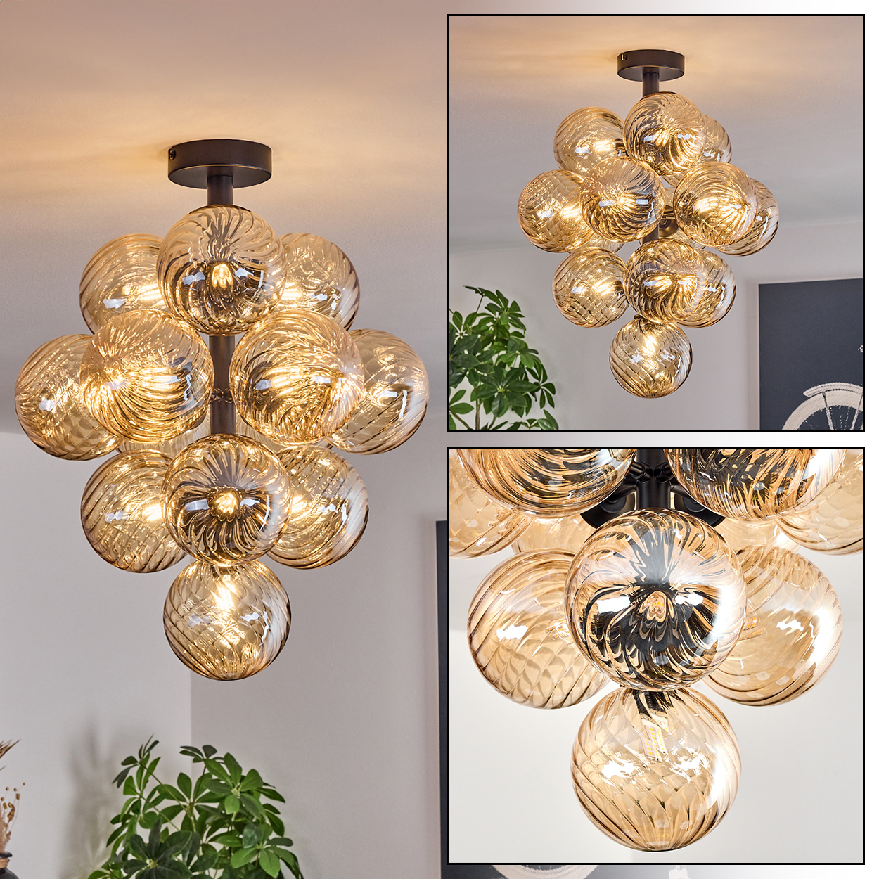 Eine dekorative Deckenlampe mit mehreren Glaskugeln. Die Kugeln sind bernsteinfarben, die Halterung dunkel. Pflanzen sind in den Ecken sichtbar.