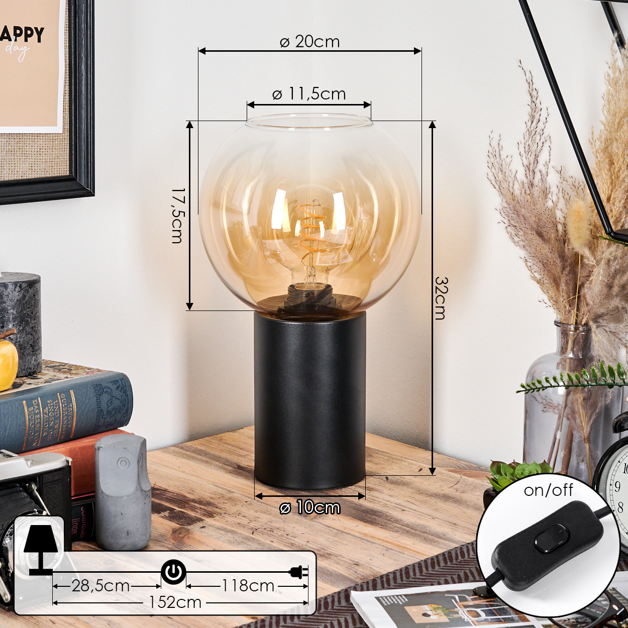 Eine moderne Lampe mit schwarzem Sockel und rundem, klarem Glasschirm. Abmessungen sind mit schwarzen Linien und Text gekennzeichnet.
