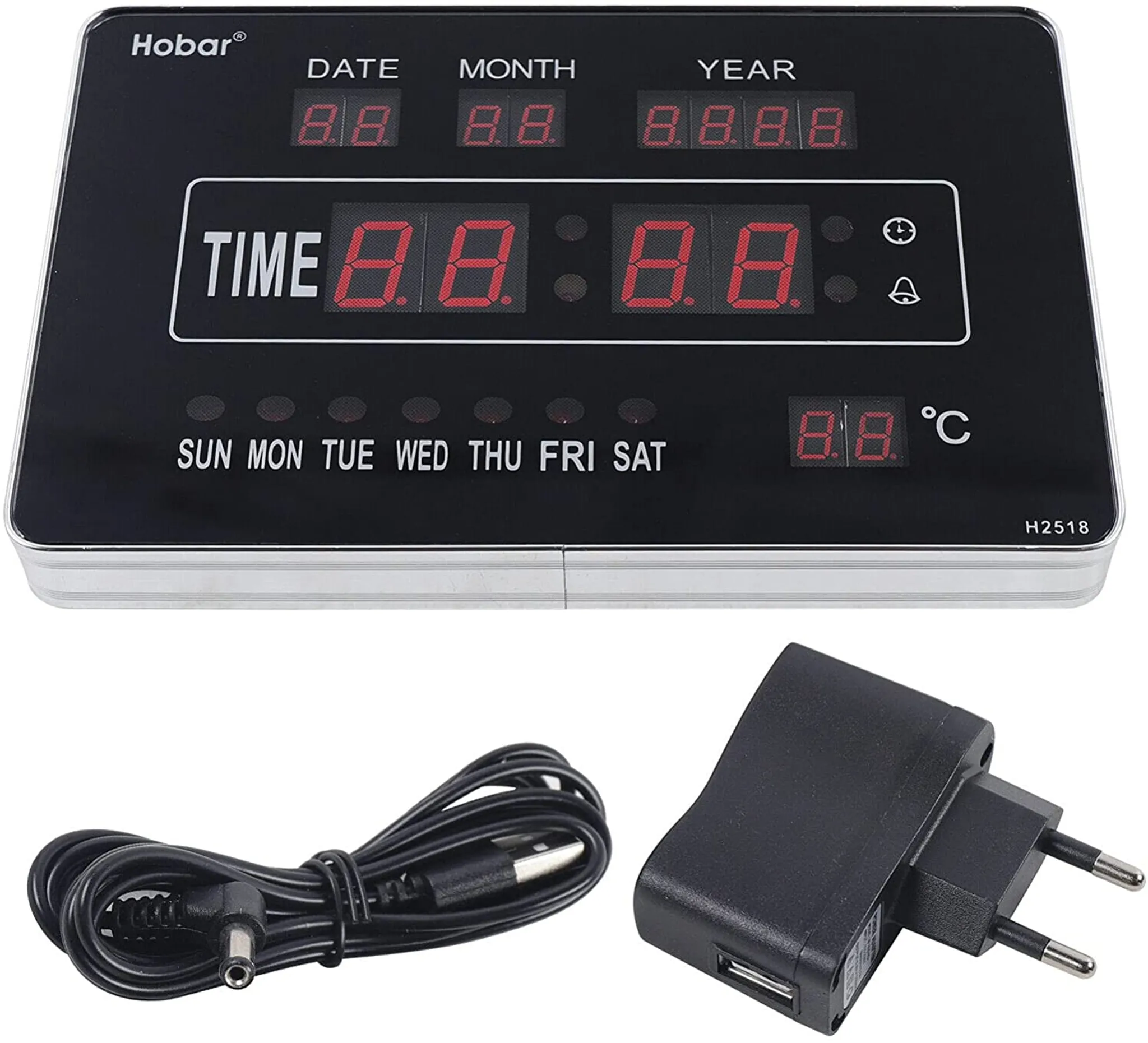 Eine Digitaluhr mit Datum, Uhrzeit und Temperatur, mit Netzteil und Kabel.