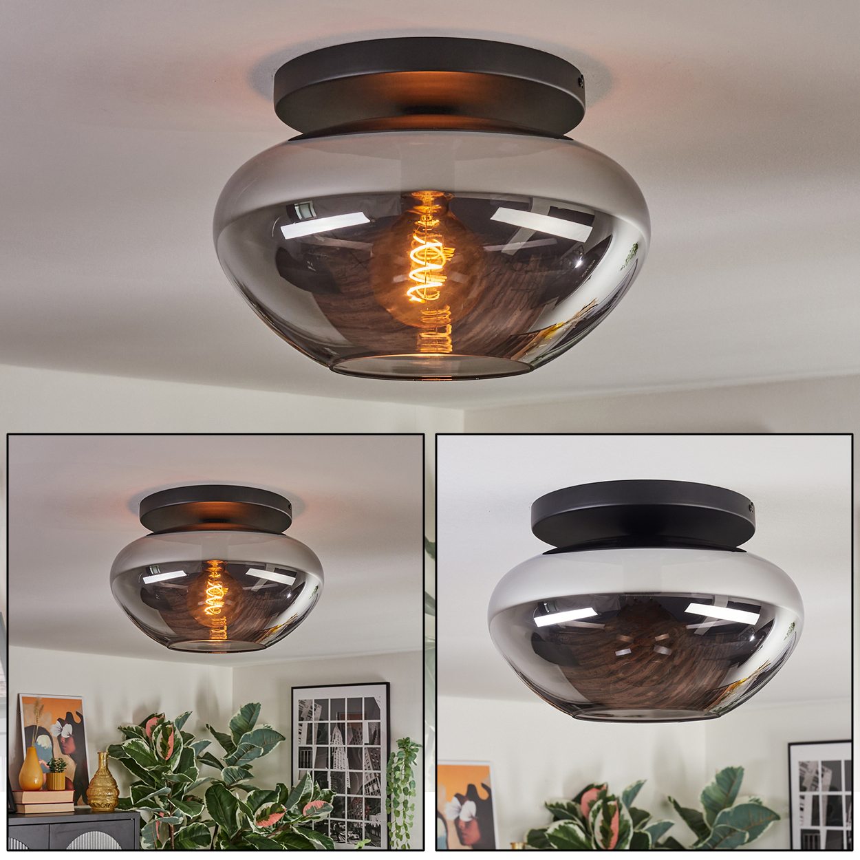Deckenlampe mit grauem Glasschirm und schwarzem Sockel. Die Glühbirne ist sichtbar. Im Raum sind weitere Lampen und Pflanzen zu sehen.