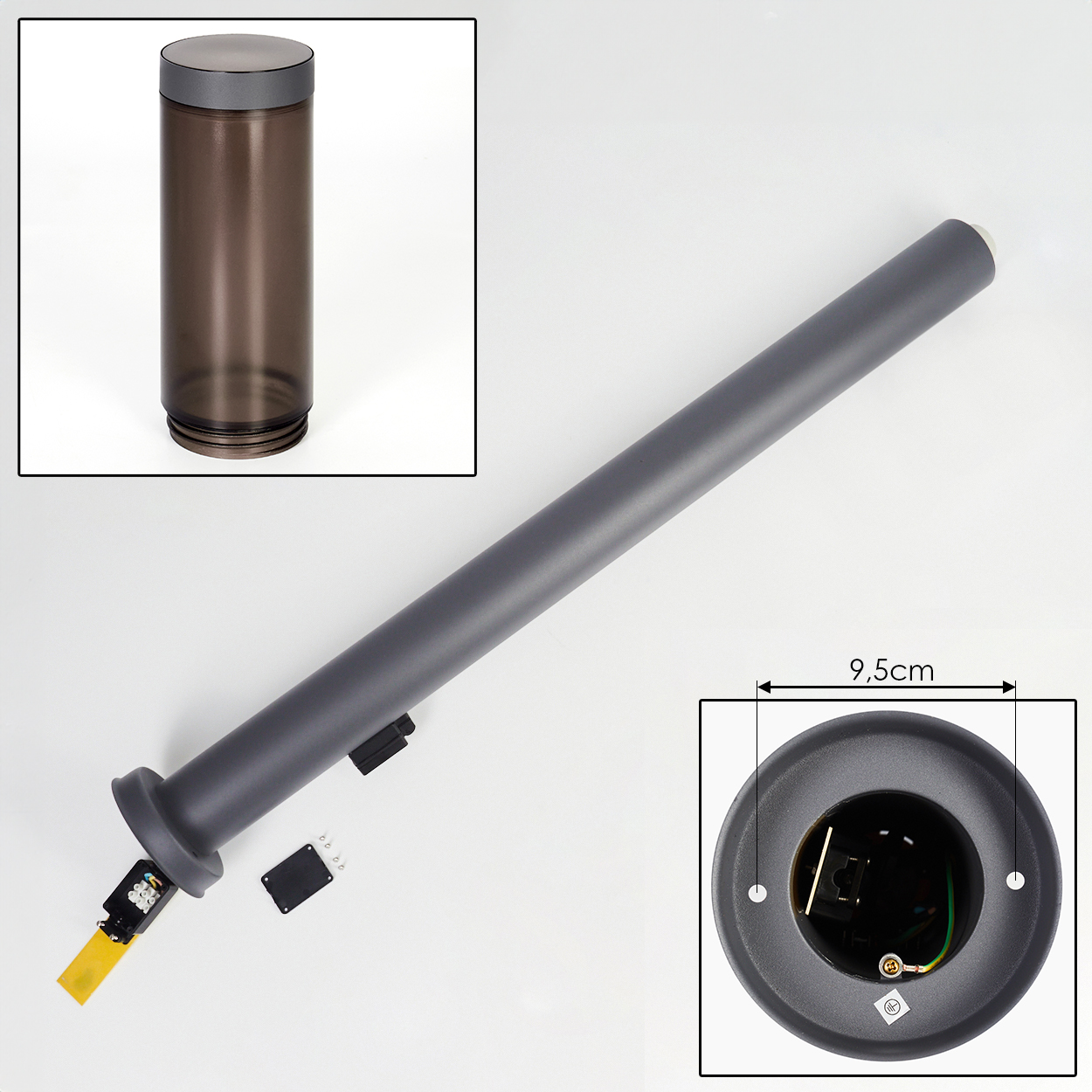 Eine zerlegte Lampe mit dunkelgrauem Gehäuse und klarer zylindrischer Abdeckung. Zusätzliche Komponenten sind abgebildet, zusammen mit einem Maß.