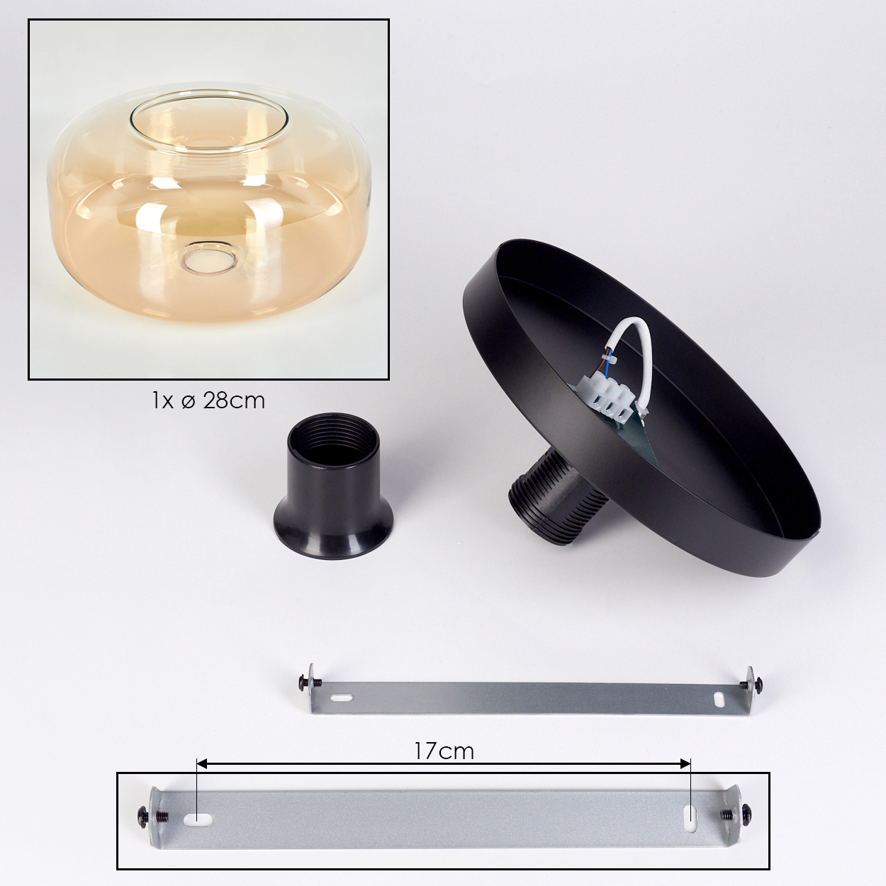 Bestandteile einer Leuchte: Glasschirm, schwarzer Metallsockel, Metallhalterung und eine schwarze Fassung. Der Schirm ist bernsteinfarben.
