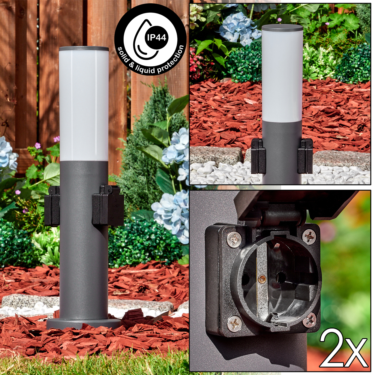 Eine graue Außenlampe mit weißem Oberteil. Sie hat eine Steckdose und ist von einem Garten mit Blumen und Mulch umgeben.