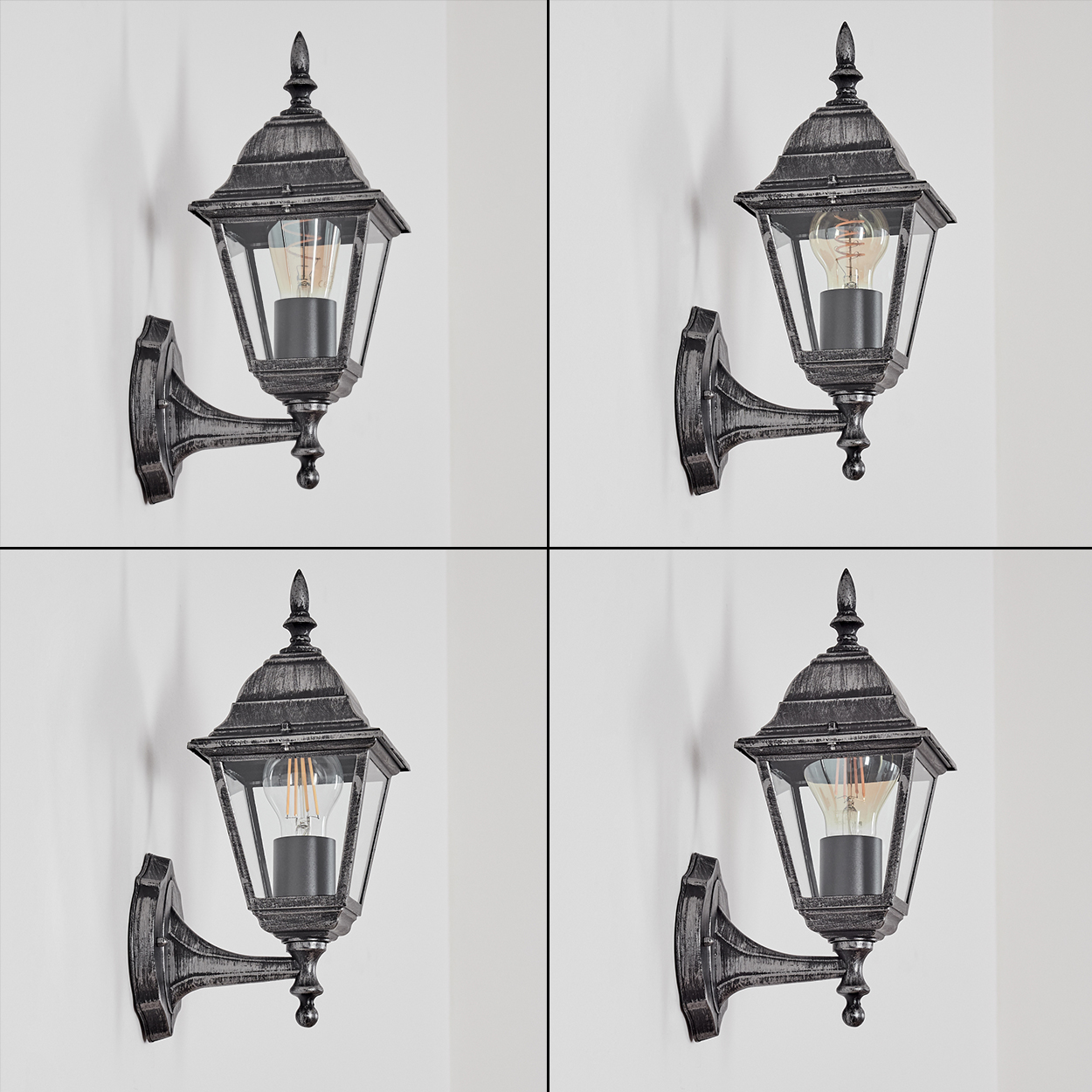 Vier identische Wandlampen im Vintage-Design. Jede Lampe hat eine dunkle Metalloberfläche, Glasplatten und eine sichtbare Glühbirne.