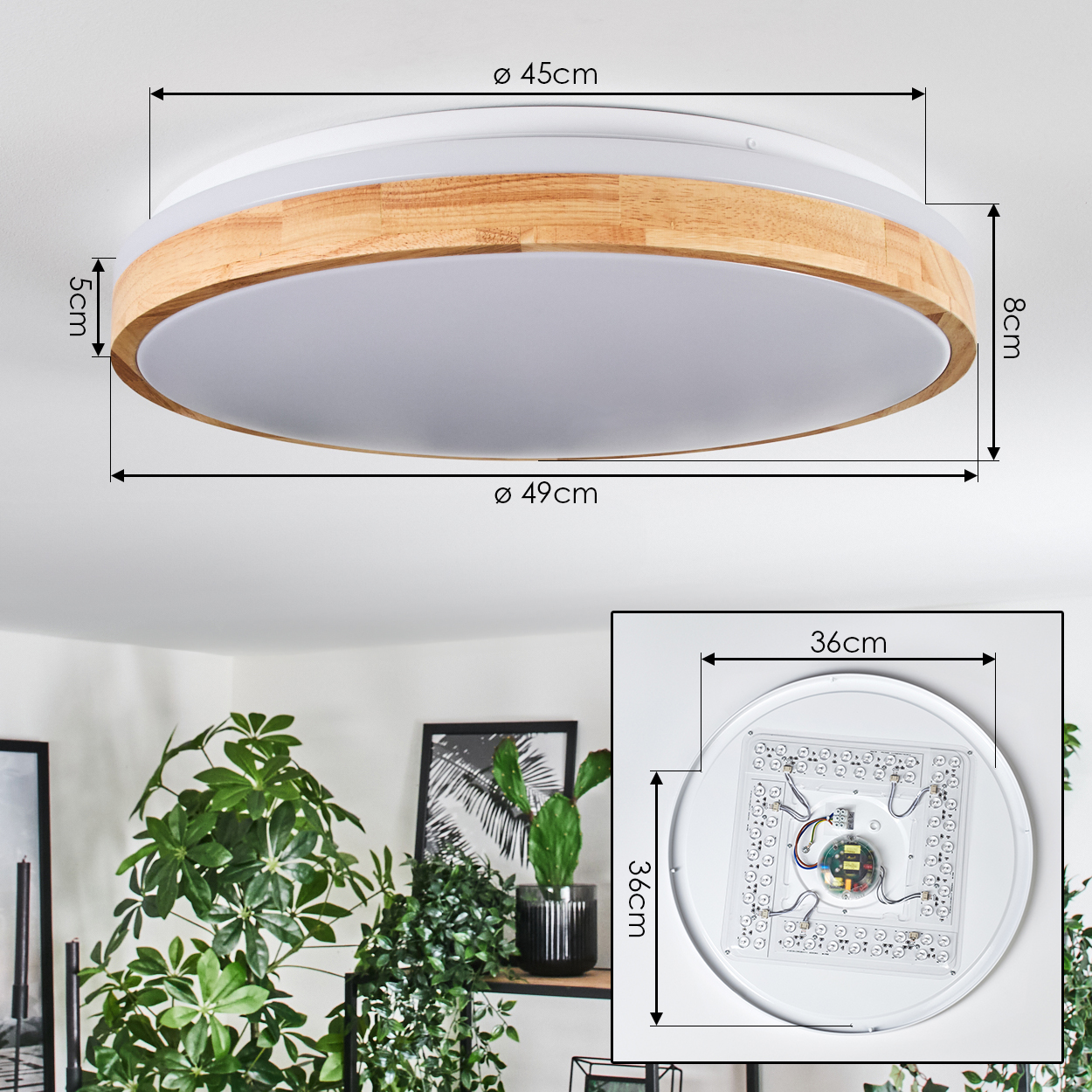 Eine Deckenlampe mit Holz- und weißen Elementen. Abmessungen sind angegeben. Im Hintergrund sind Pflanzen und ein Bilderrahmen zu sehen.
