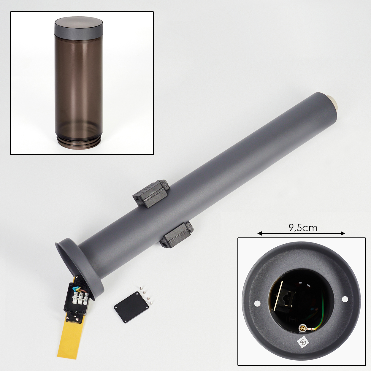 Graue zylindrische Lampe mit Teilen. Enthält eine Querschnittsansicht und einen kleineren Einsatz eines durchscheinenden Zylinders.
