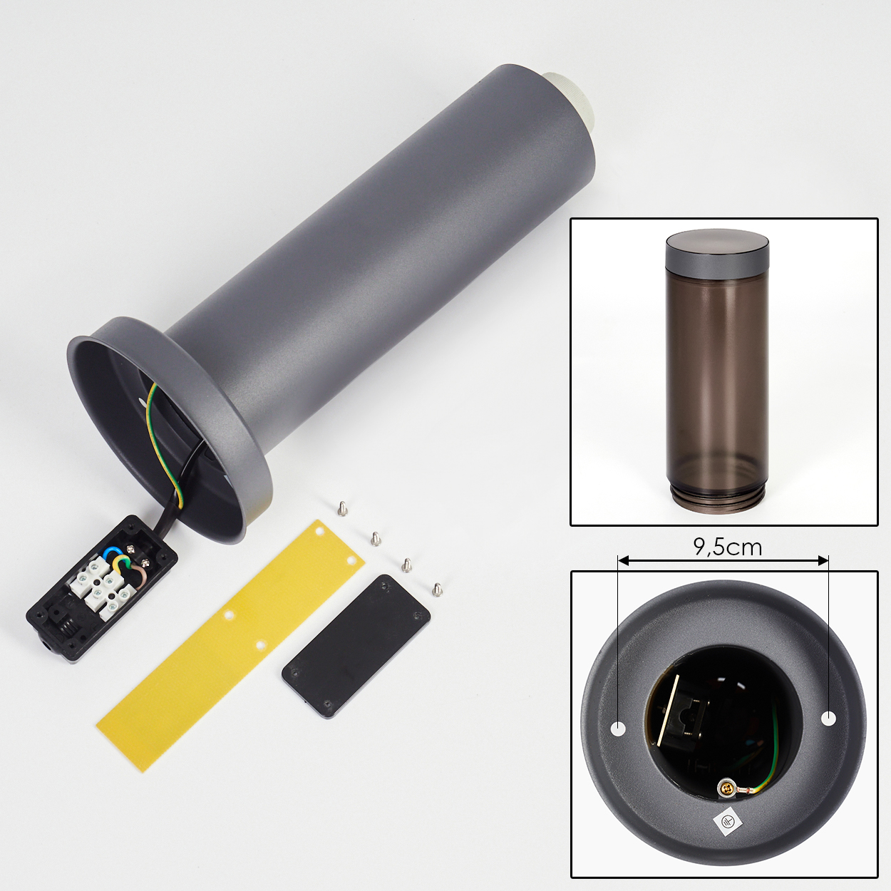 Zerlegte graue Lampenteile auf weißem Hintergrund. Enthält einen zylindrischen Körper, einen Sockel und elektrische Komponenten.