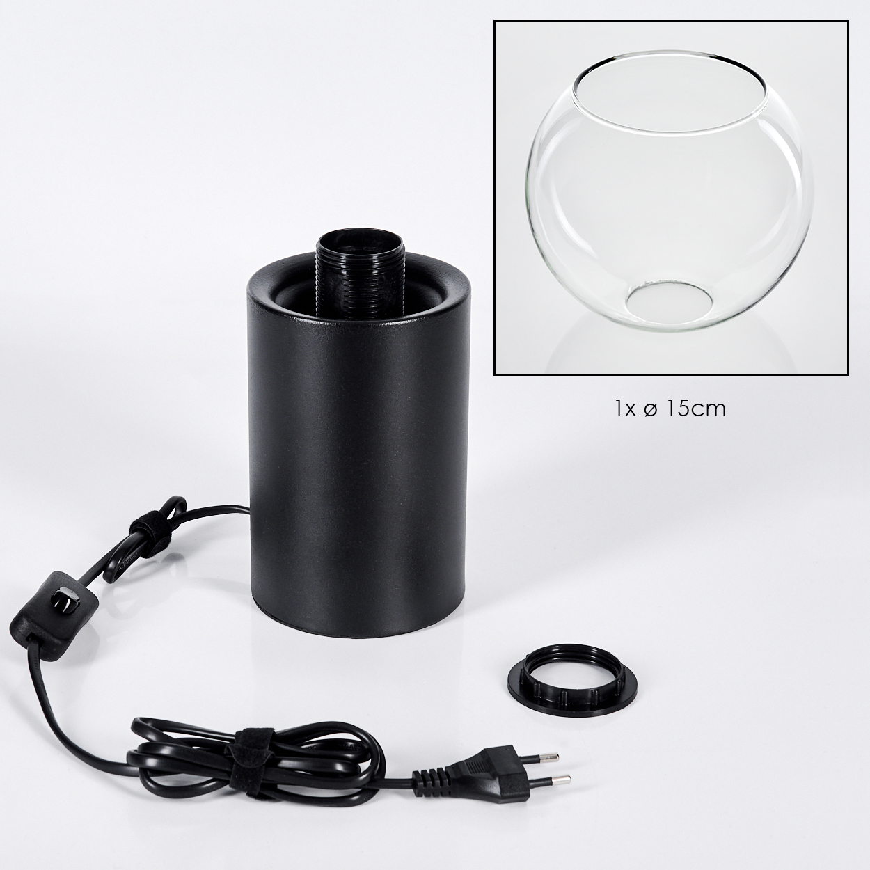 Schwarzer Lampensockel, Glaskugel, Netzkabel und ein separater schwarzer Ring auf weißer Oberfläche. Eine klare Glaskugel wird angezeigt.