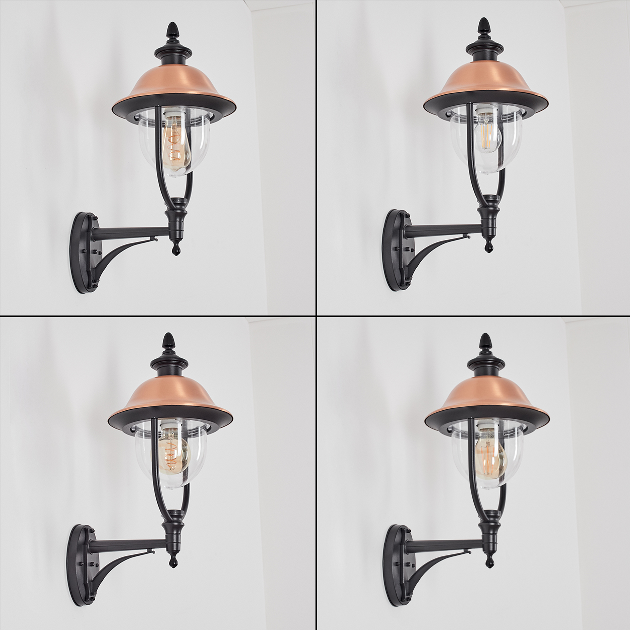 Vier identische Wandlampen mit schwarzem Rahmen, kupferfarbenem Oberteil und klarem Glas. Die Lampen sind an einer weißen Wand befestigt.
