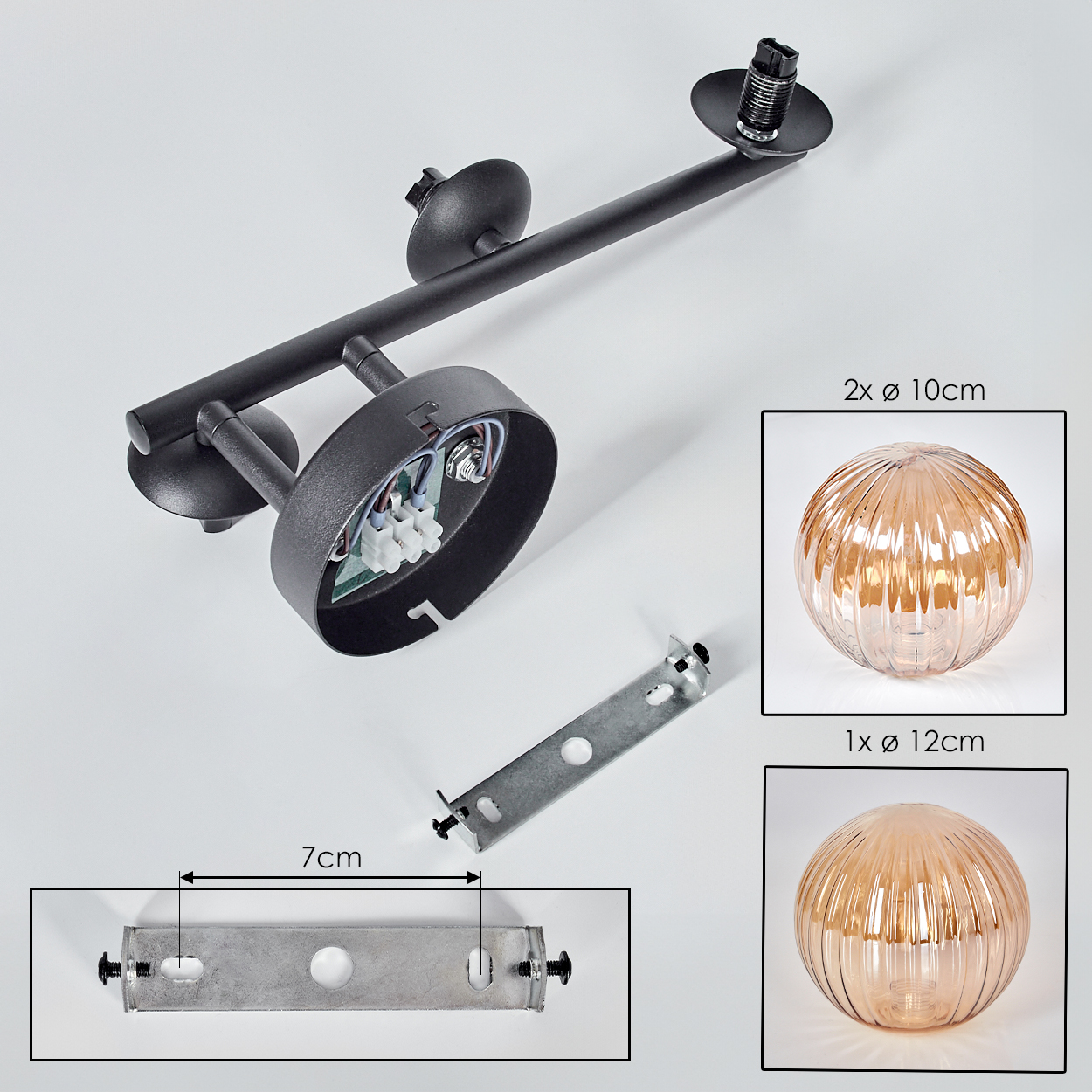 Schwarze Lampenteile mit zwei Glaskugeln. Darunter eine Metallhalterung mit einer 7cm-Abmessung.