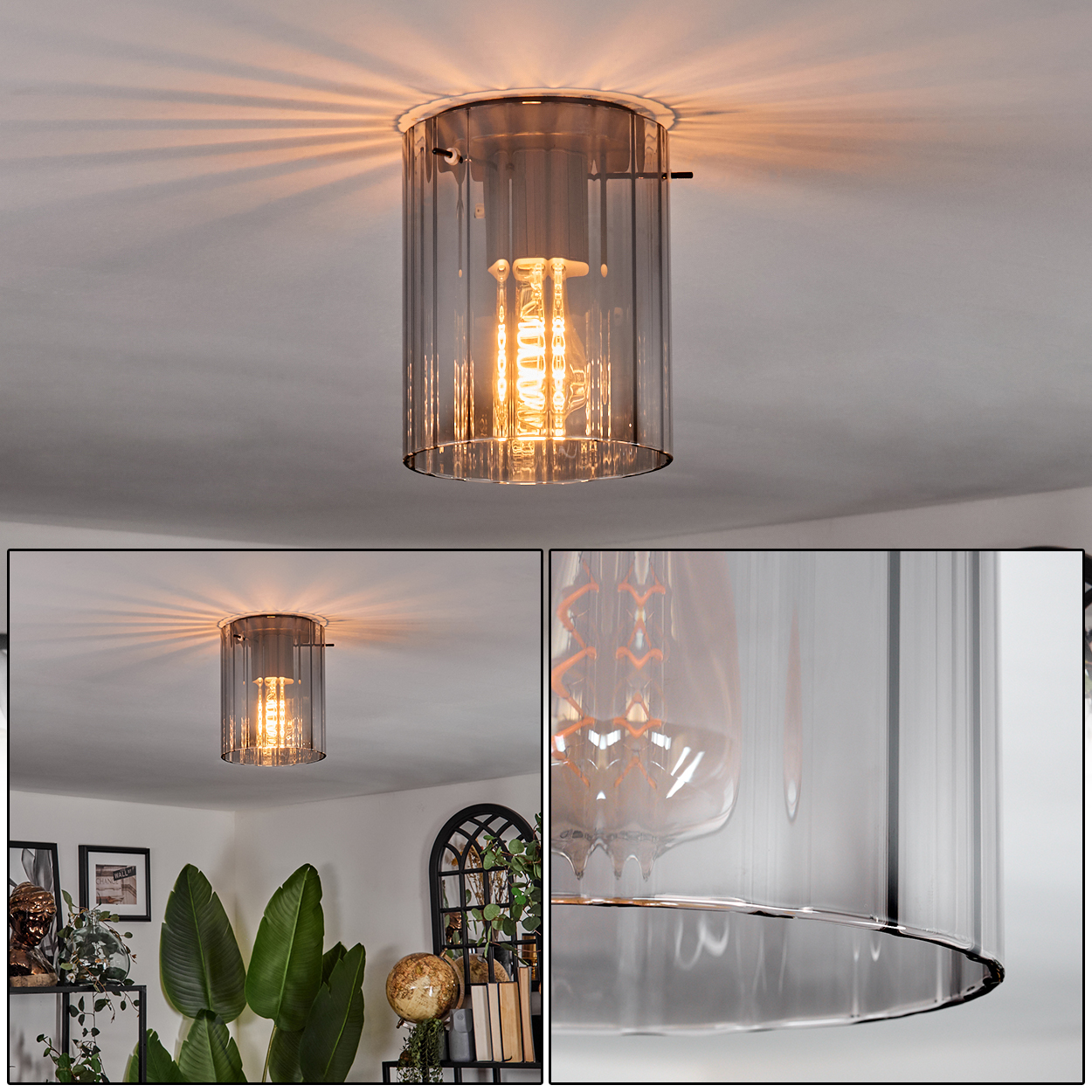 Eine moderne Deckenlampe mit zylindrischem Glasschirm. Die Glühbirne leuchtet und wirft das Licht nach oben. Der Raum hat Pflanzen und Dekor.