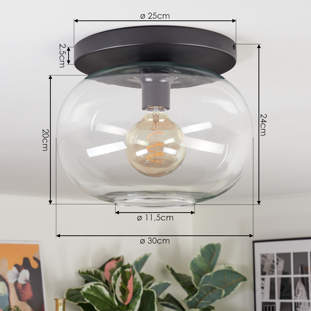 Eine moderne Deckenleuchte mit klarem Glasschirm und sichtbarer Glühbirne. Abmessungen sind um die Lampe angegeben.