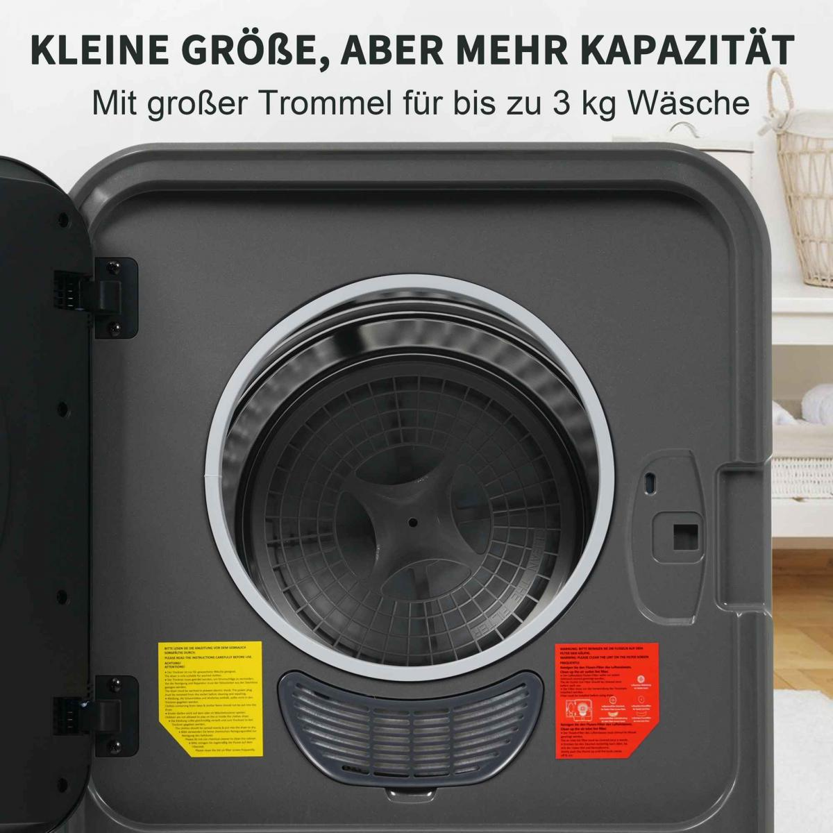 Eine dunkelgraue Waschmaschine ist geöffnet und zeigt die Trommel. Text sagt 'Kleine Größe, aber mehr Kapazität'. Im Hintergrund ein Korb und ein Regal.