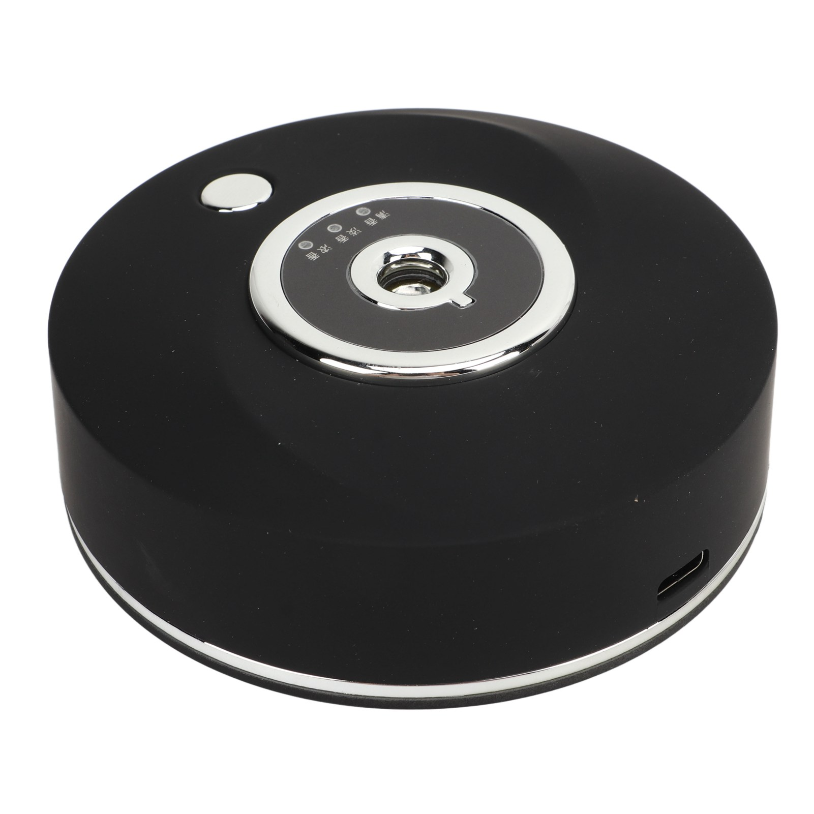 Ein schwarzes, rundes Gerät mit silbernen Akzenten. Es hat ein zentrales Zifferblatt und eine Taste. USB-Anschluss sichtbar.