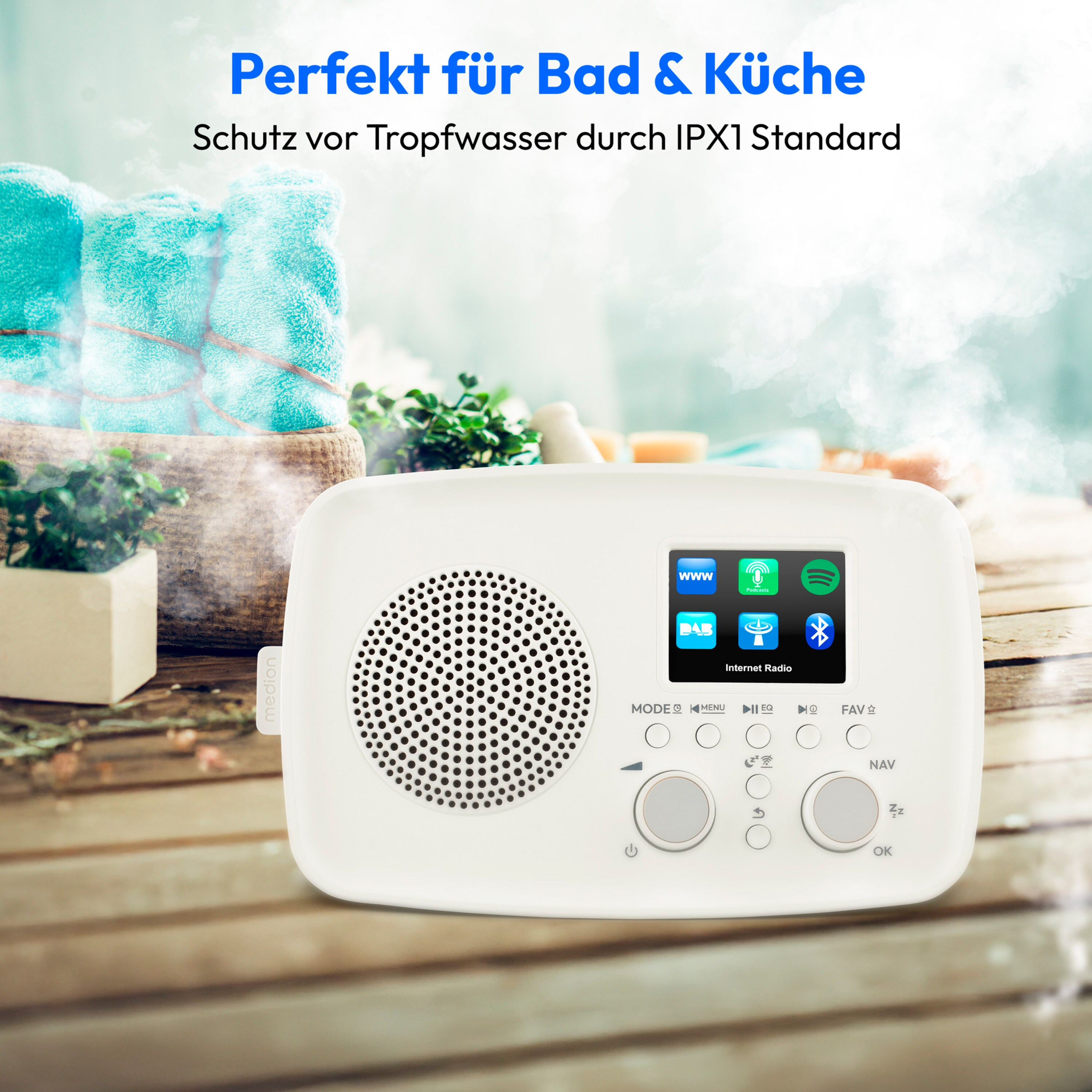 A white radio with a screen sits on wood. Blue towels and plants are behind it. Text says 'Perfect for Bath & Kitchen'.