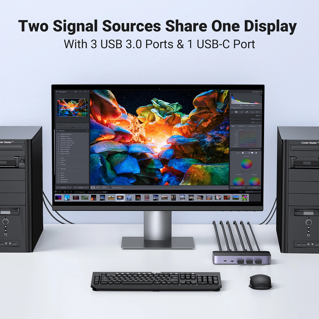 Konfiguracja komputera z dwiema wieżami, monitorem wyświetlającym obraz oraz klawiaturą i myszą na białym biurku.