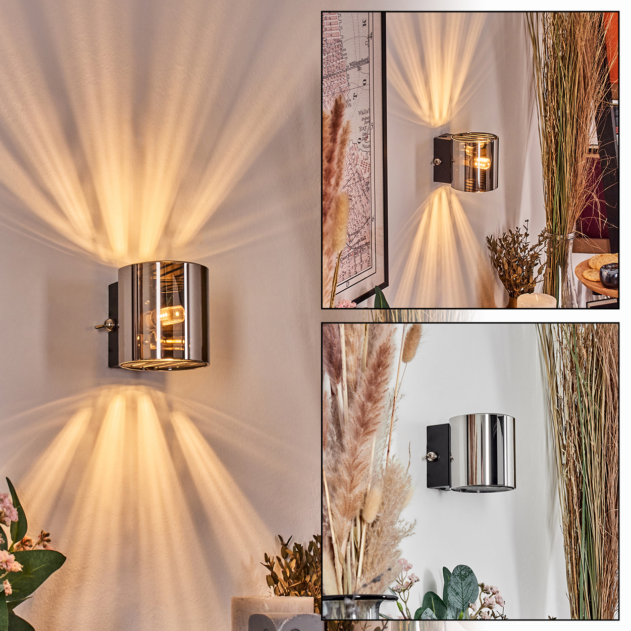 Drei Wandlampen mit silbernem Finish sind an einer weißen Wand montiert und werfen Lichtmuster. Trockene Pflanzen und eine gerahmte Karte sind sichtbar.