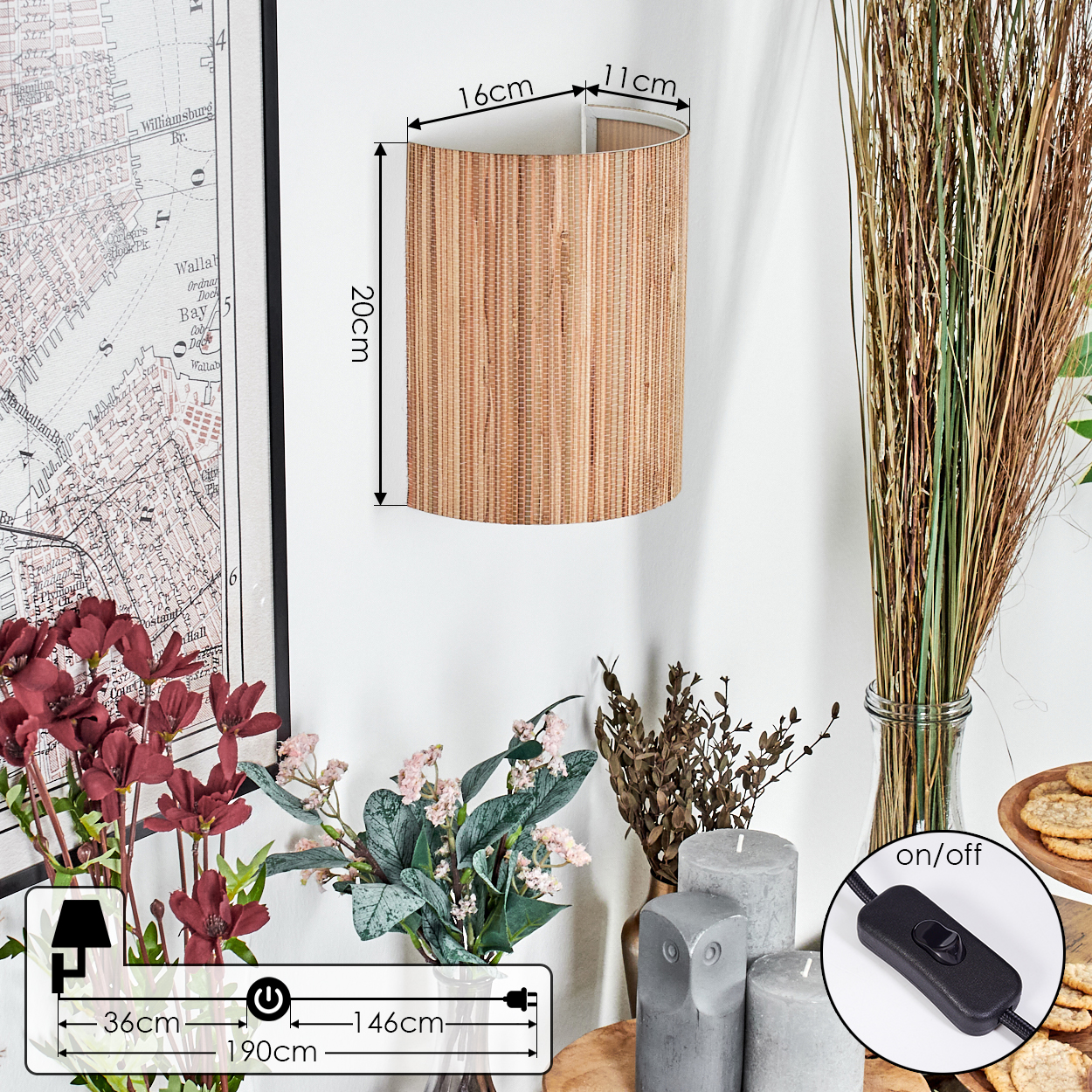 Eine gewebte Lampe an einer weißen Wand, mit Blumen, Kerzen und Snacks im Vordergrund und einer Karte im Hintergrund.