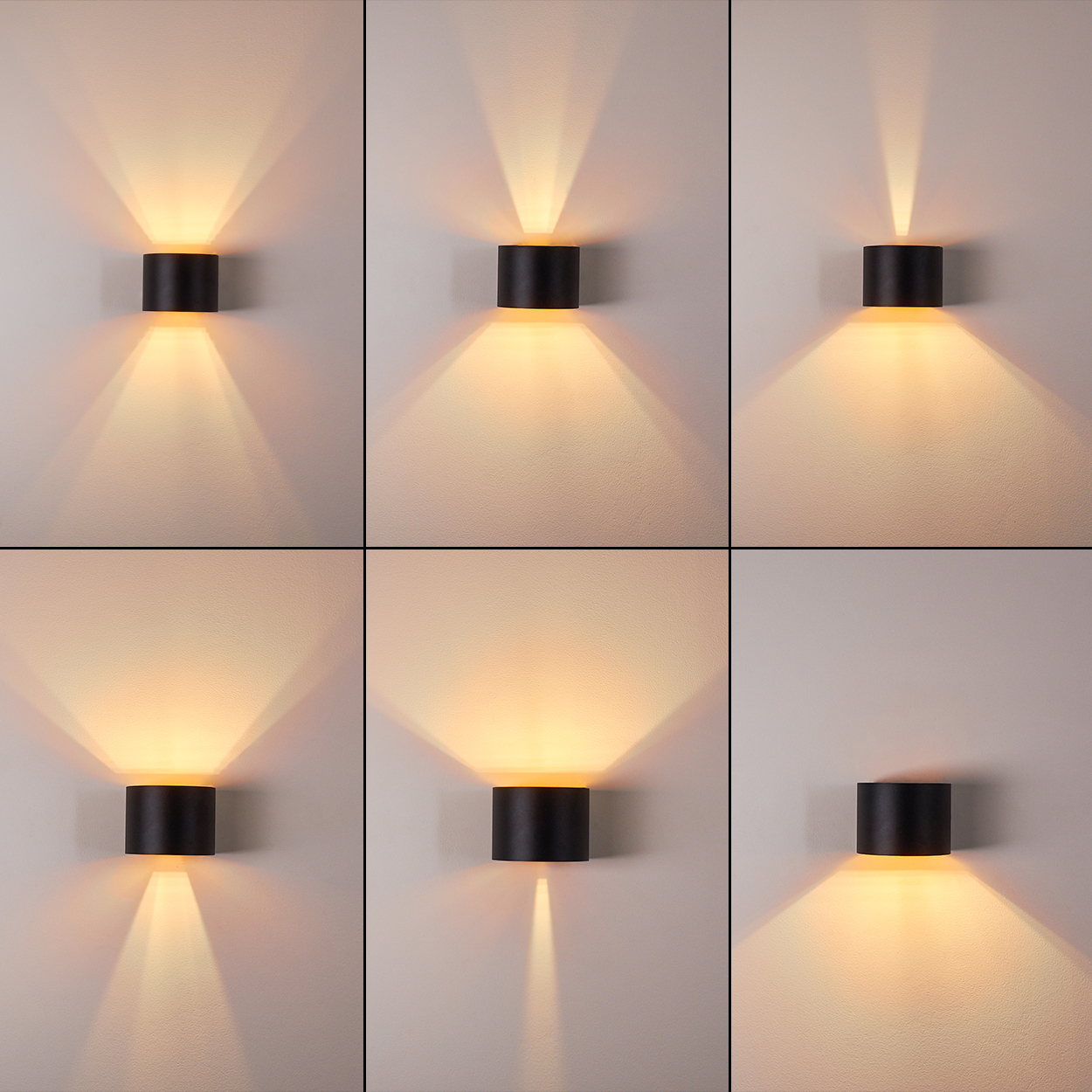 Sechs schwarze zylindrische Wandleuchten strahlen warmes Licht auf eine weiß strukturierte Wand. Die Leuchten haben zwei Strahlen.