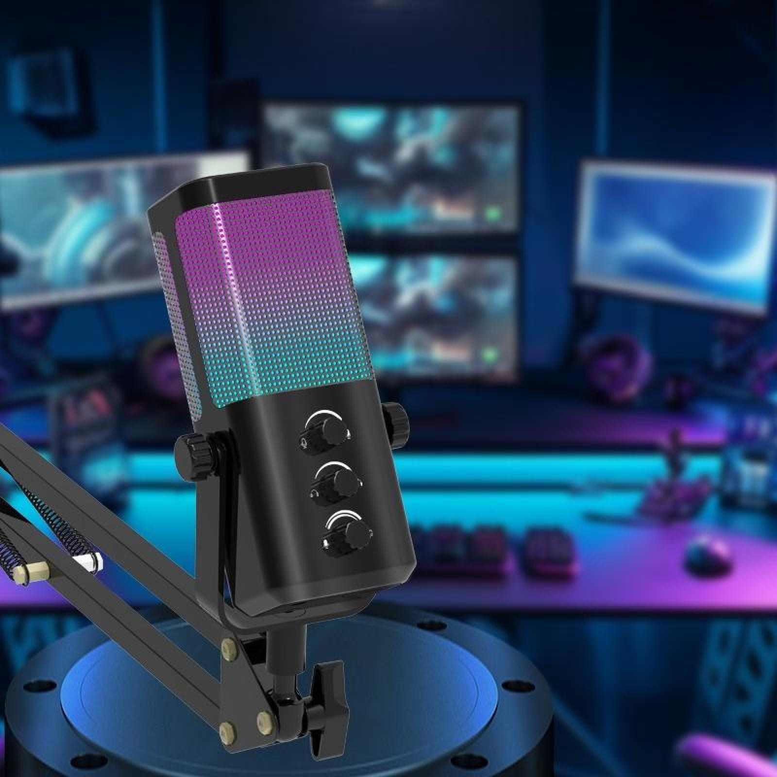 Ein schwarzes Mikrofon mit bunten Lichtern im Vordergrund. Monitore und Tastatur sind im Hintergrund unscharf.