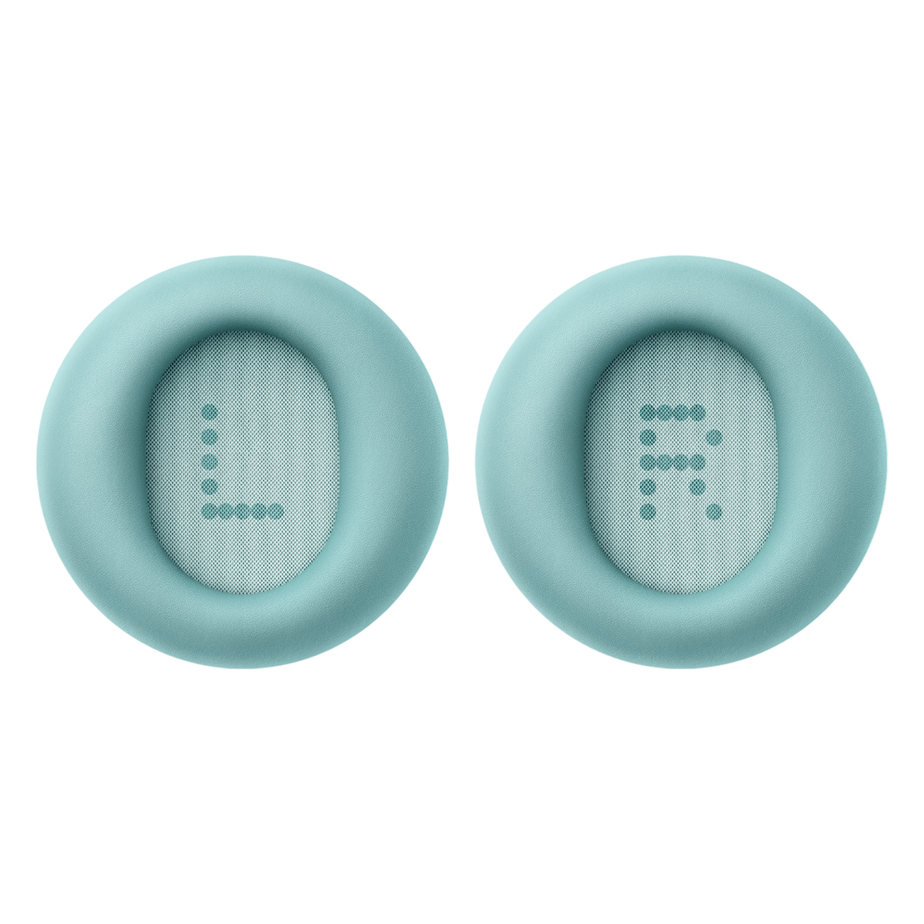 Dwie turkusowe poduszki na uszy. Lewa ma 'L' z kropek, prawa 'R'. Obydwie mają siatkę w środku.