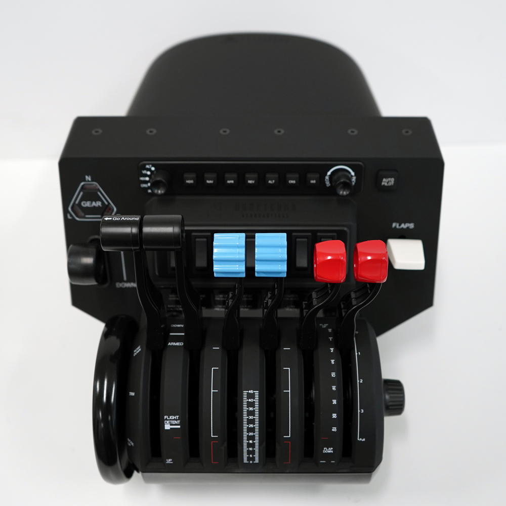 A black flight control panel with levers, knobs, and colored controls. Blue and red handles. White background.