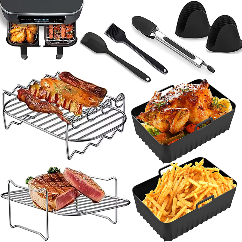Ein Airfryer mit Essen, Zubehör wie Zangen, Spatel und Silikonhandschuhen. Ebenfalls enthalten sind gekochtes Fleisch und Pommes.