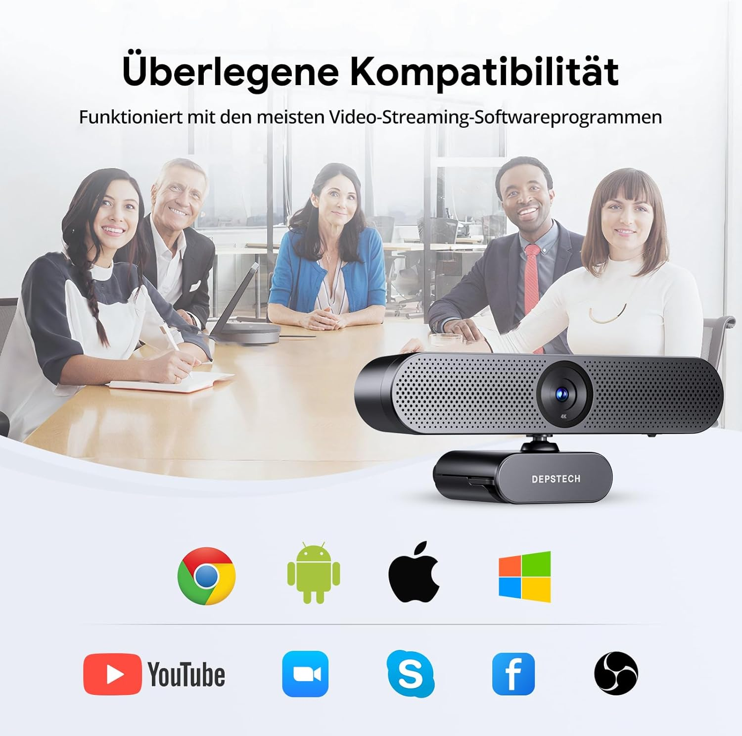 Grupa osób na spotkaniu. Kamera internetowa na stole, ikony aplikacji poniżej. Tekst u góry: Najwyższa kompatybilność.