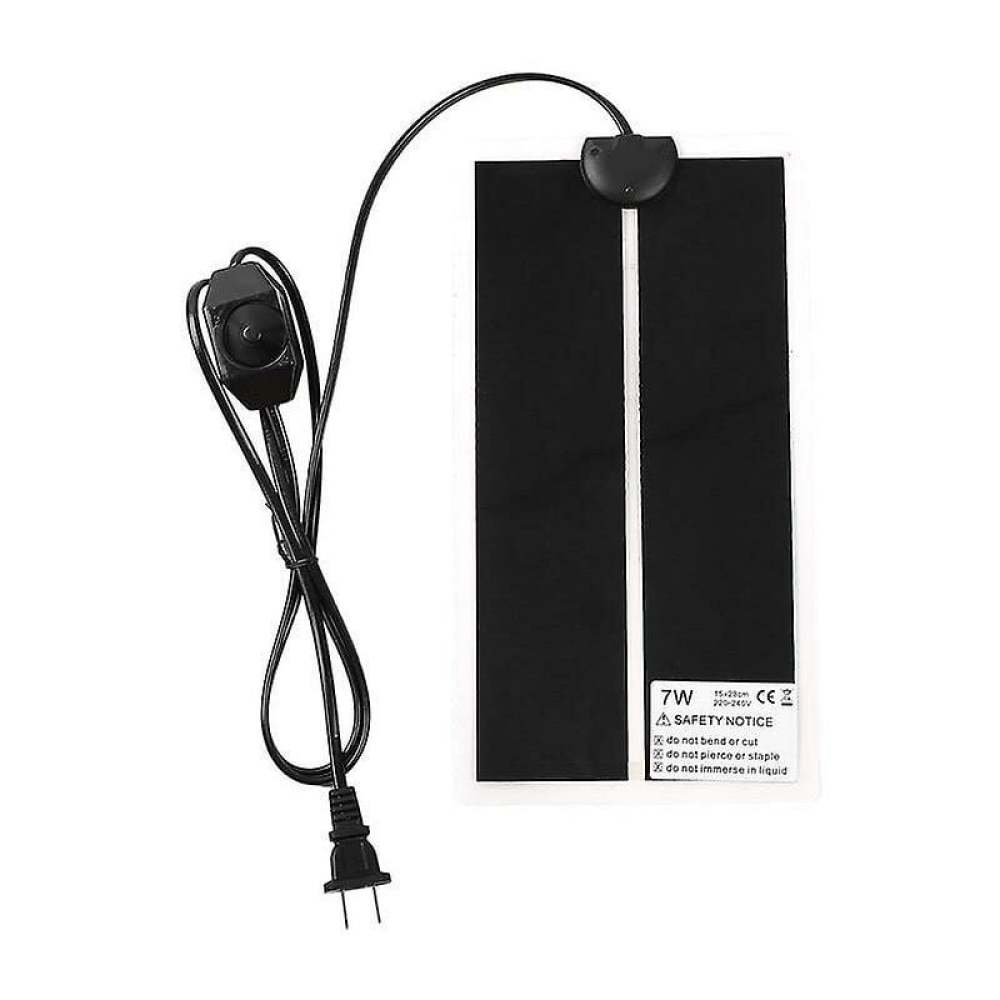 Eine schwarze Heizmatte mit Netzkabel und Stecker. Weißes Sicherheitshinweisschild mit Text.
