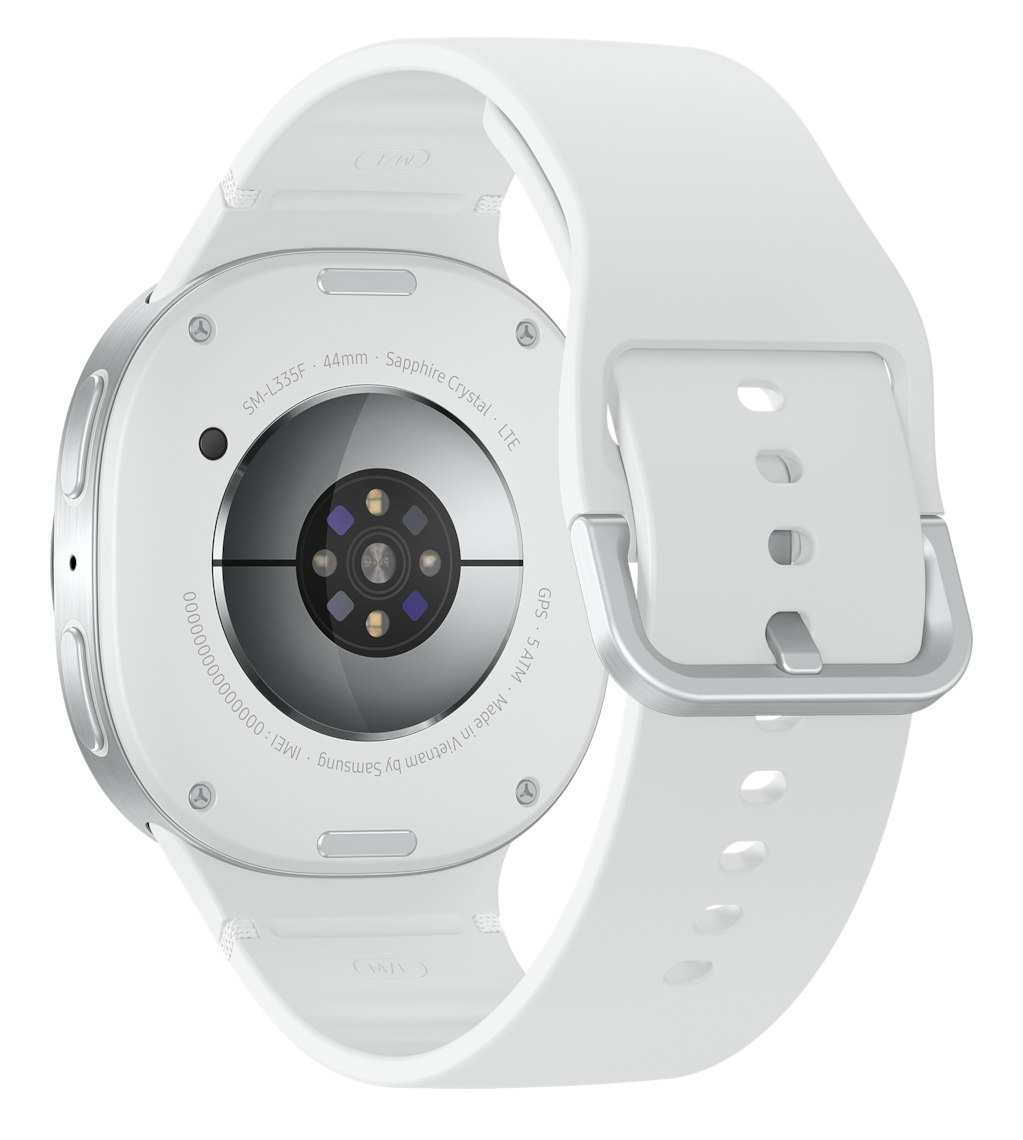 Biały smartwatch ze srebrną ramką i białym paskiem. Szczegóły obejmują model, wymiary i informacje produkcyjne z tyłu.