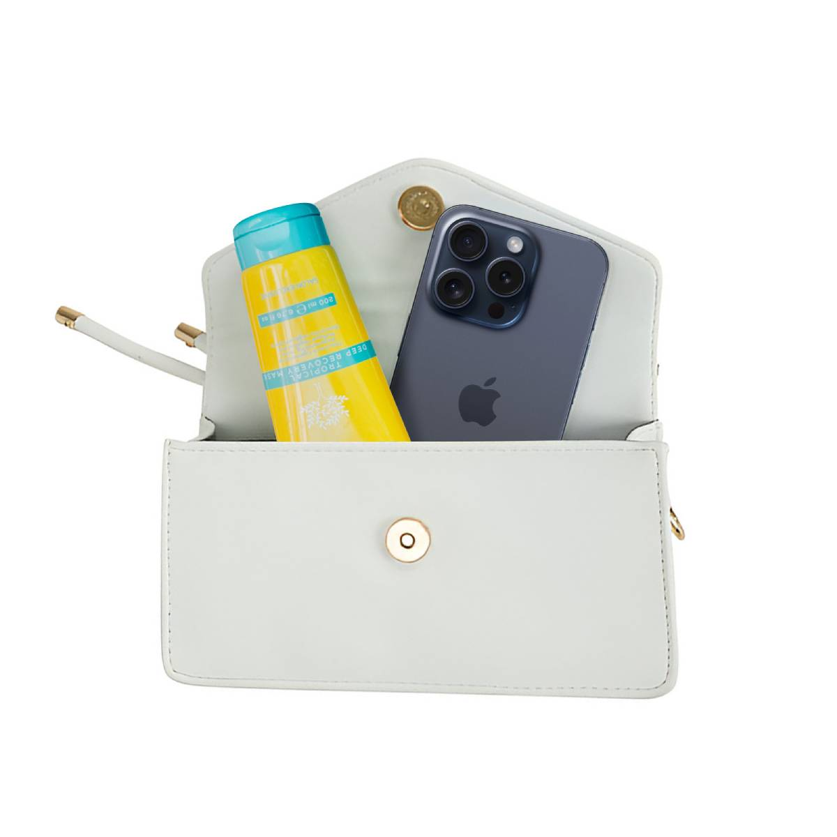 Eine weiße, offene Handtasche mit einer gelben Tube und einem Telefon darin. Das Telefon ist dunkelblau mit dem Apple-Logo.