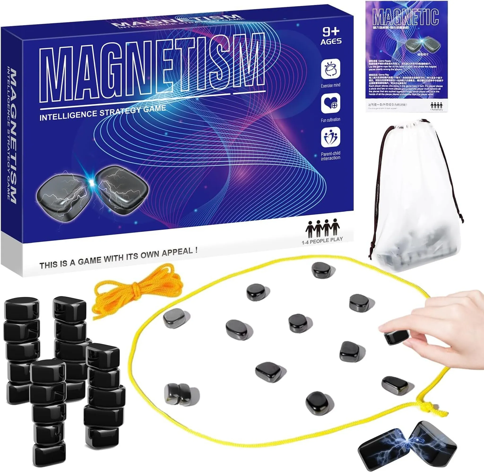 Eine Spielbox mit dem Wort MAGNETISMUS. Schwarze Magnetsteine und gelbes Seil liegen auf dem Tisch. Eine Hand nimmt einen Stein.