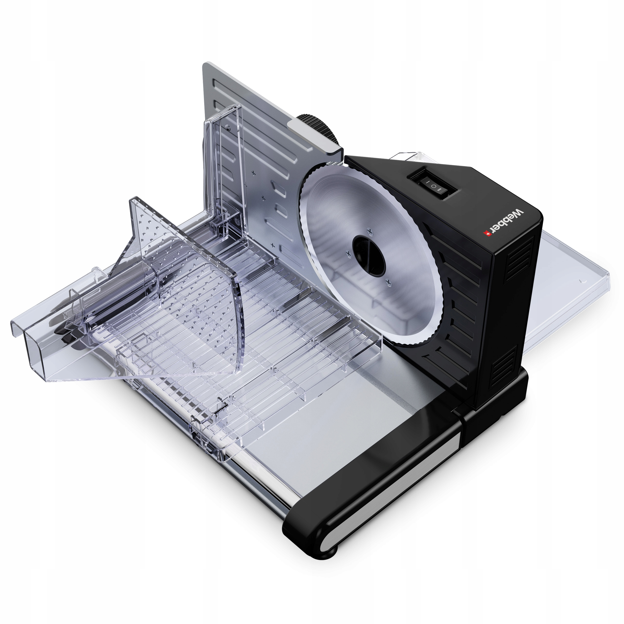 Czarno-srebrna krajalnica do żywności na białej powierzchni. Posiada okrągłe ostrze i przezroczyste elementy.