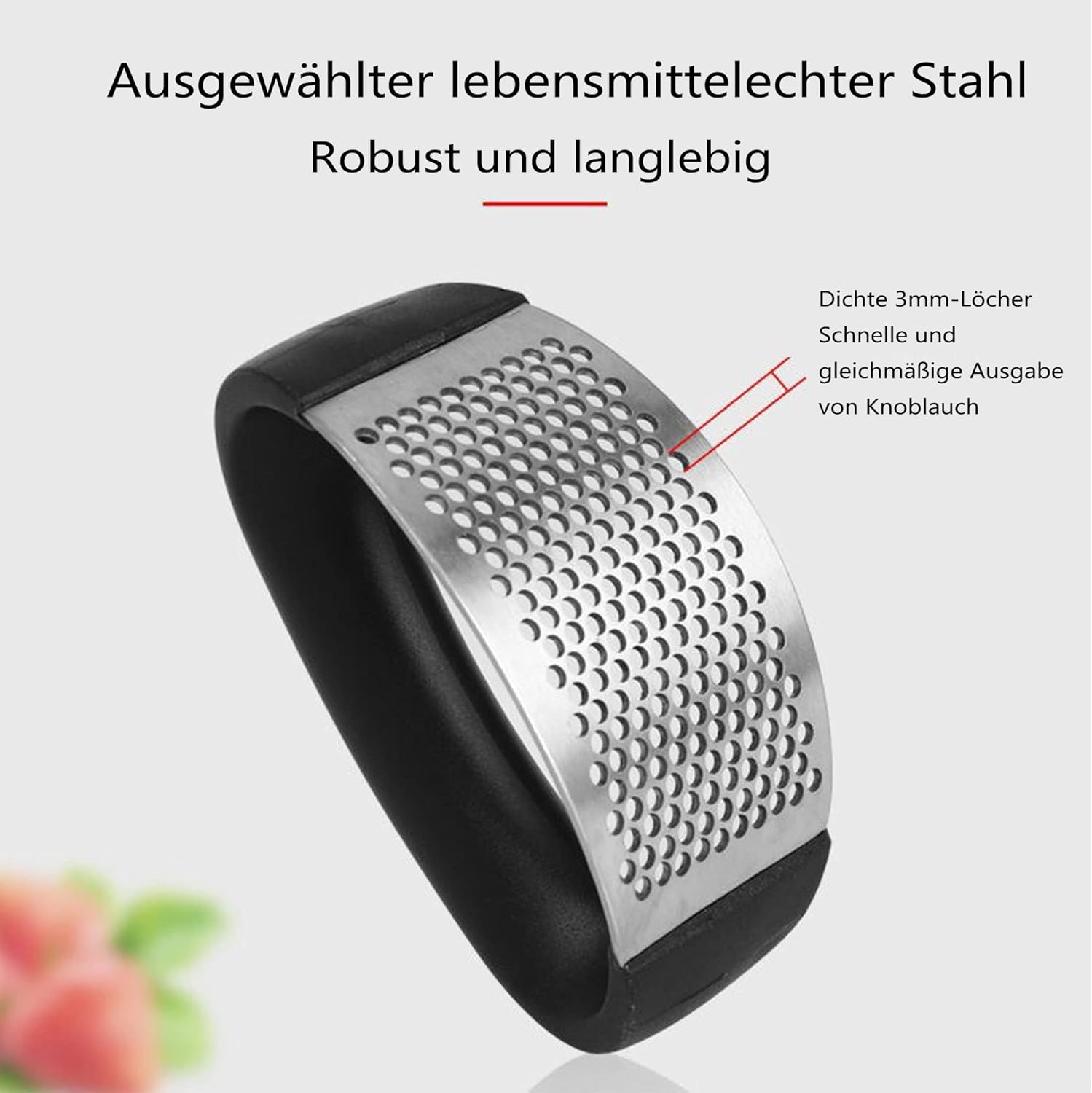 Knoblauchreibe mit schwarzem Griff und Edelstahl-Reibefläche. Text besagt, dass sie robust und aus lebensmittelechtem Stahl gefertigt ist.