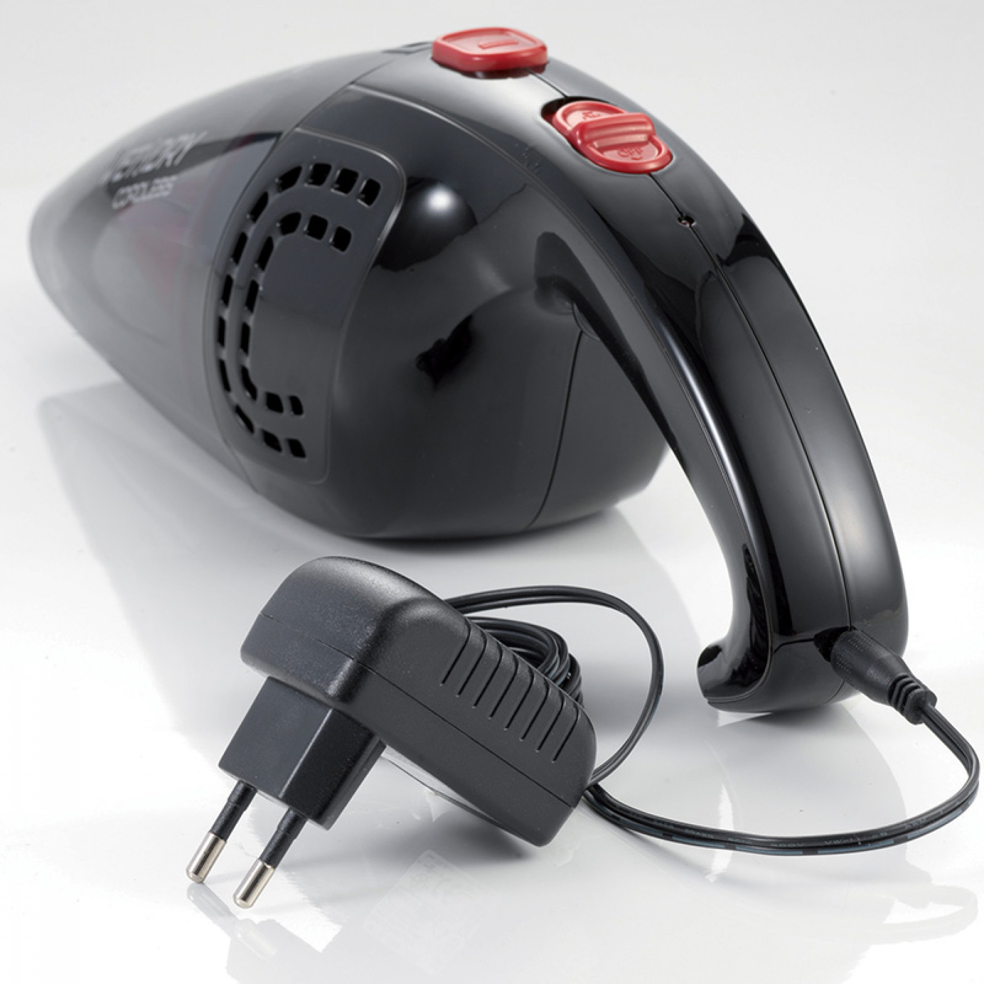 Black cordless vacuum cleaner with red buttons and a black charger, on a white surface.