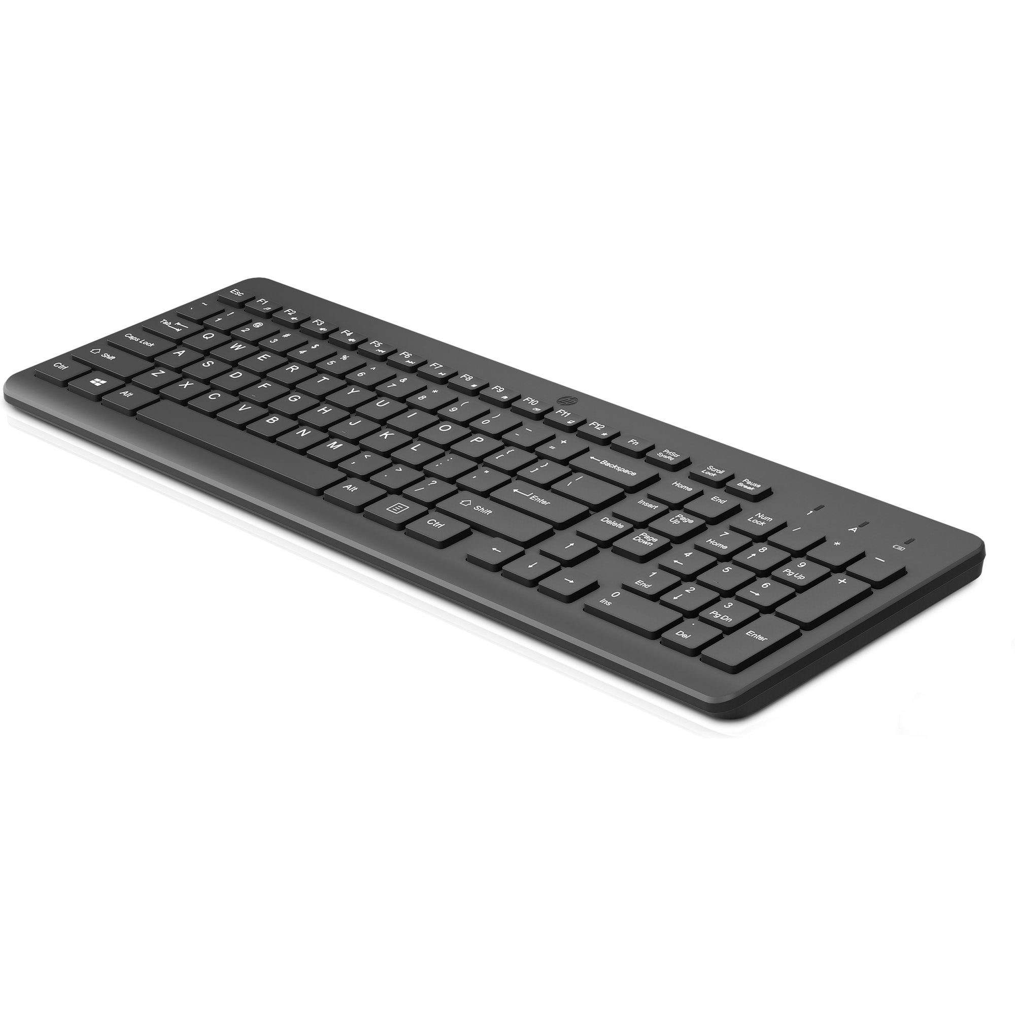 Un teclado de computadora negro sobre una superficie blanca. Tiene teclas para letras, números y funciones, con un diseño elegante.